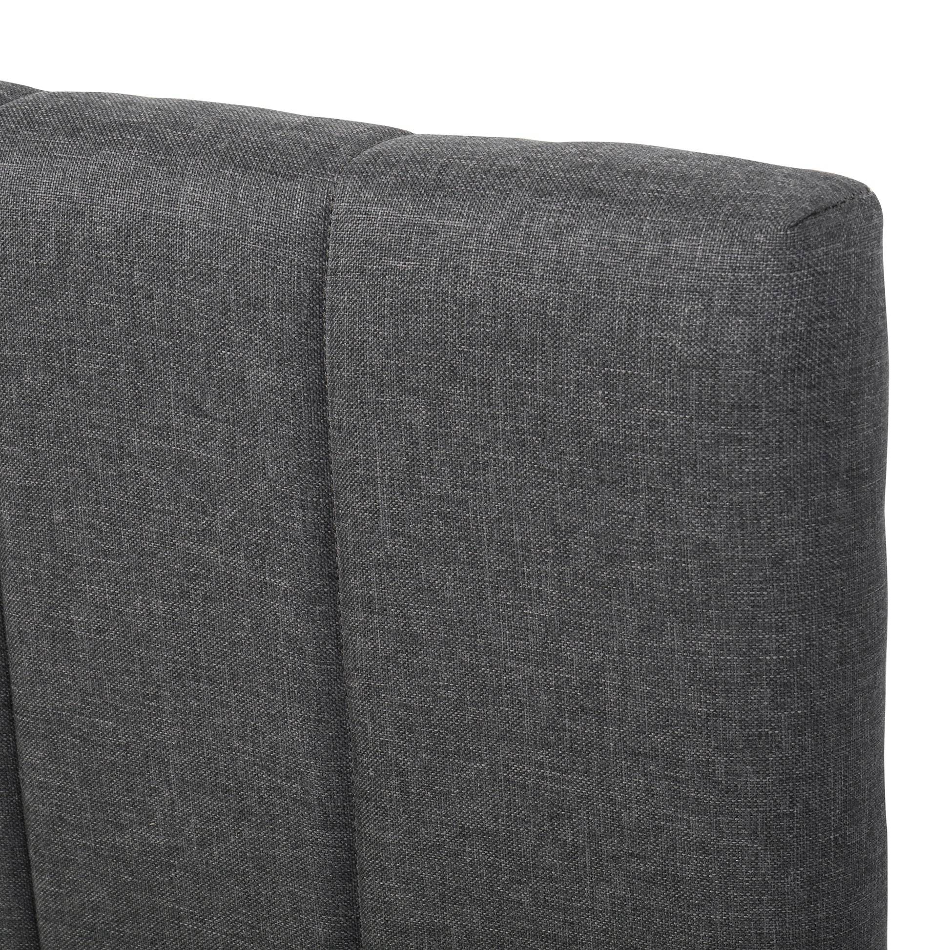 Closeup of dark grey linen tufted headboard fabric