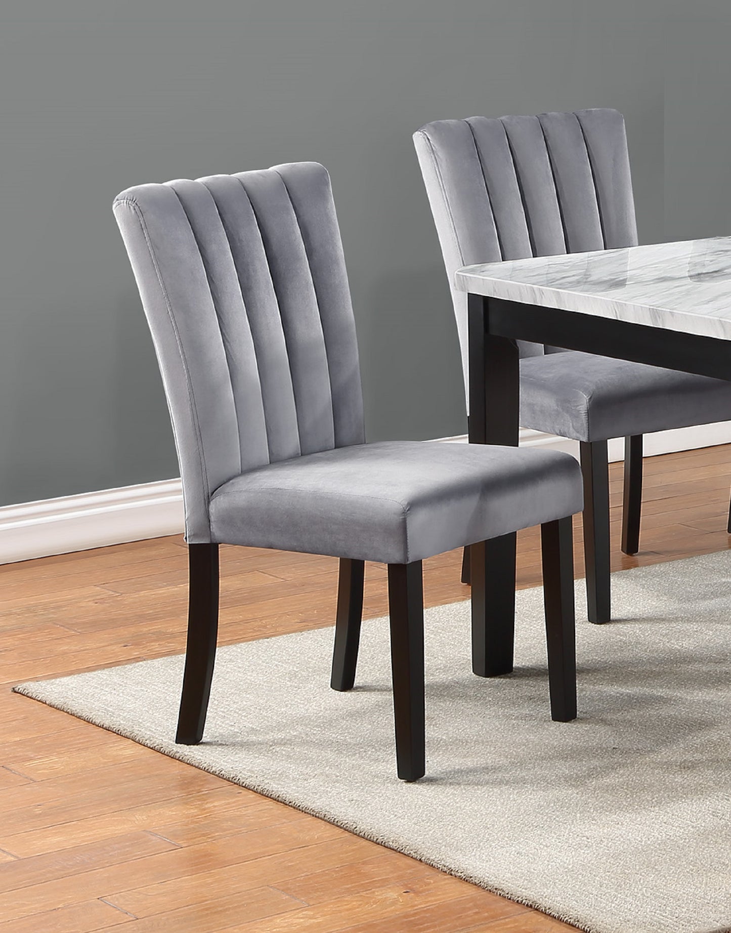 Grey velvet dining chair with channel tufting