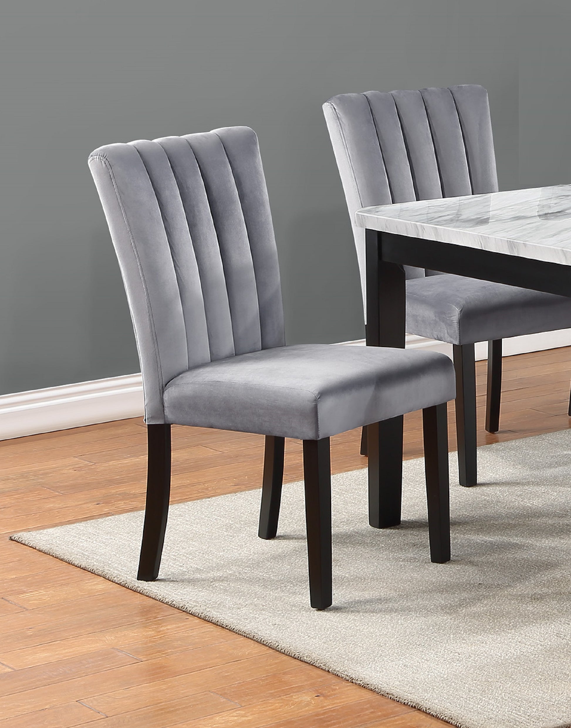 Grey velvet dining chair with channel tufting