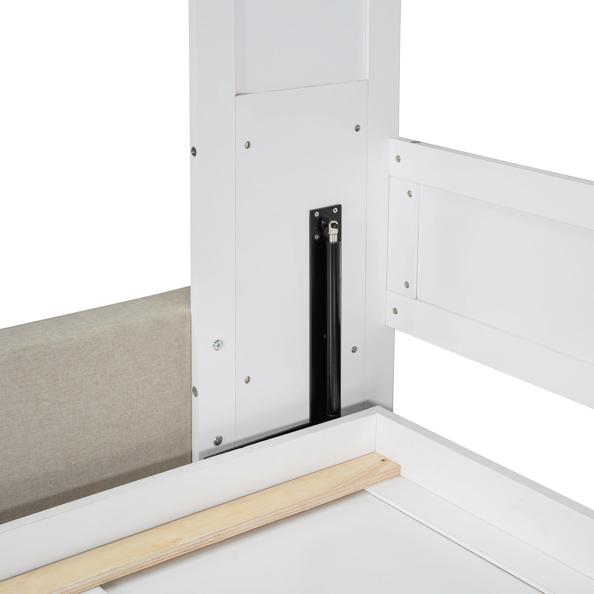 Close up of white bed frame detail with upholstered headboard and hydraulic lift mechanism