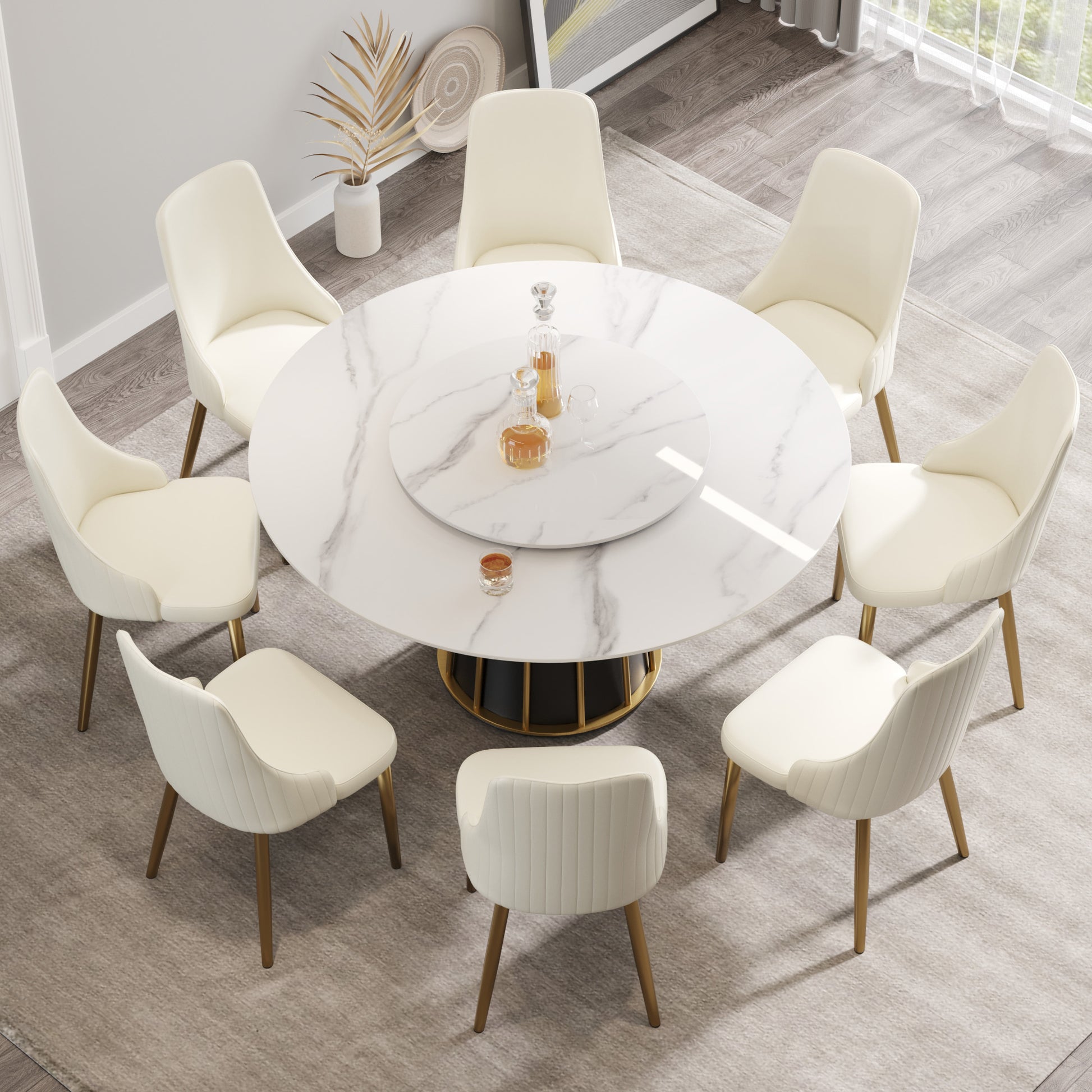 Cream velvet dining chairs around a white marble pedestal table