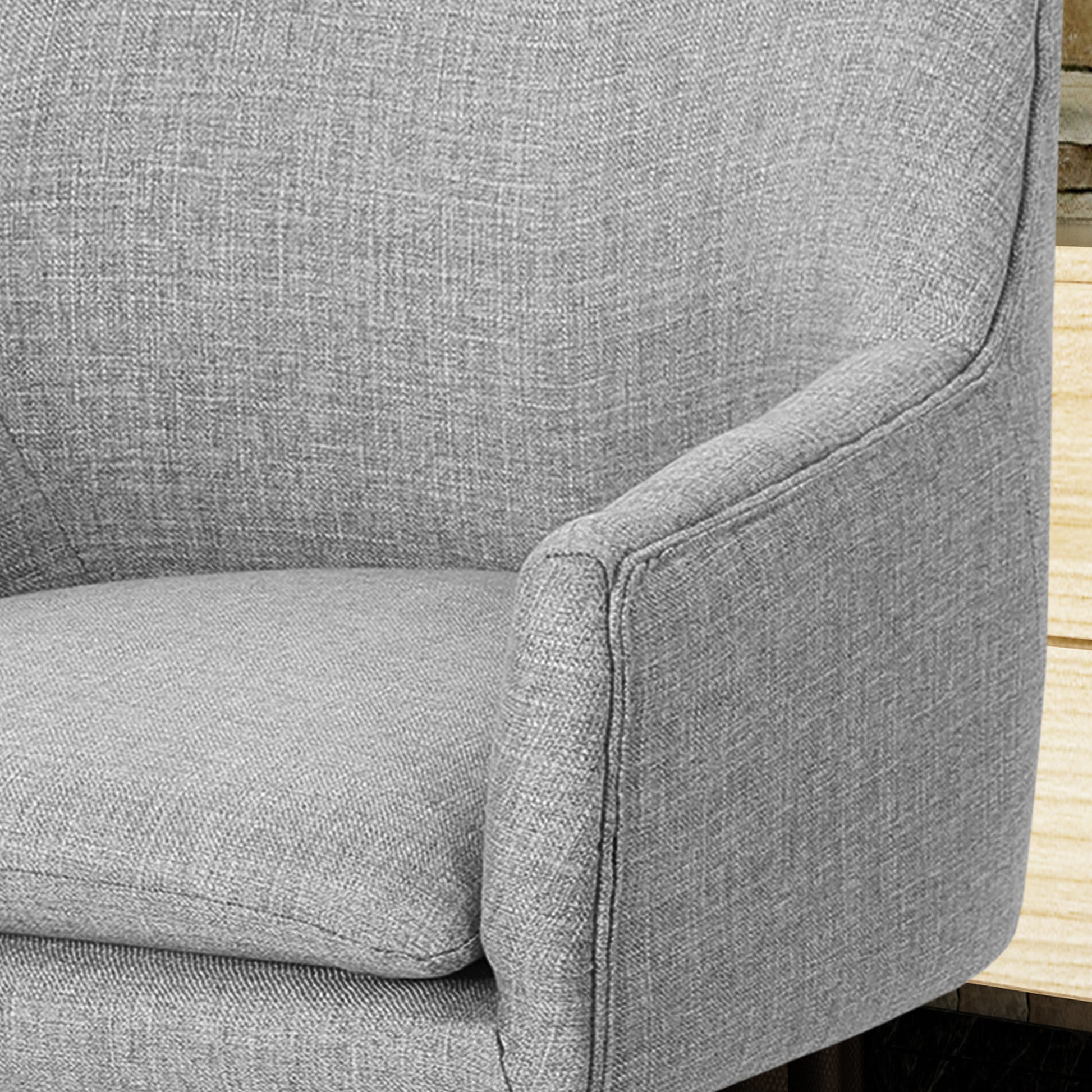 Gray textured fabric armchair detail