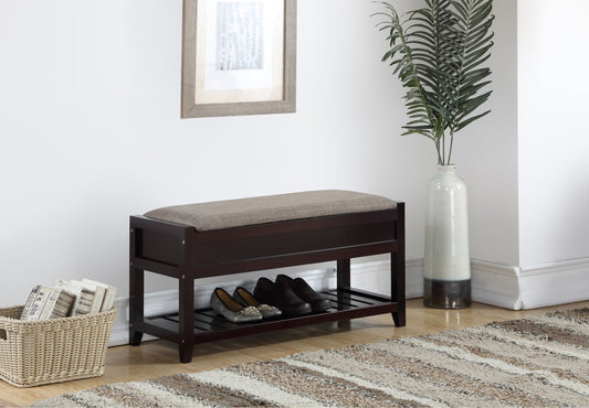 Dark brown storage bench with cushioned top and two shelves storing shoes
