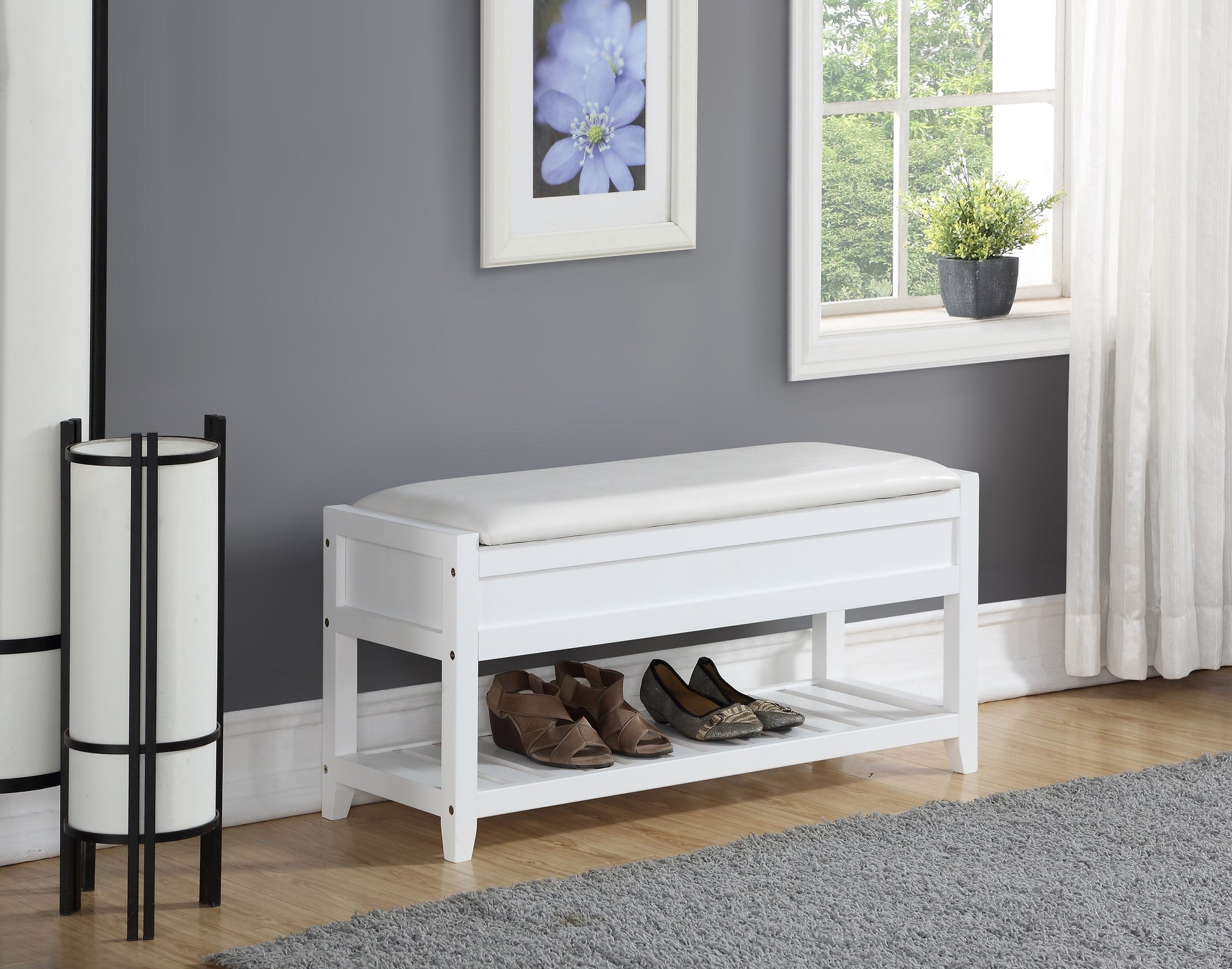 White storage bench with cushioned seat and two shelves for shoes