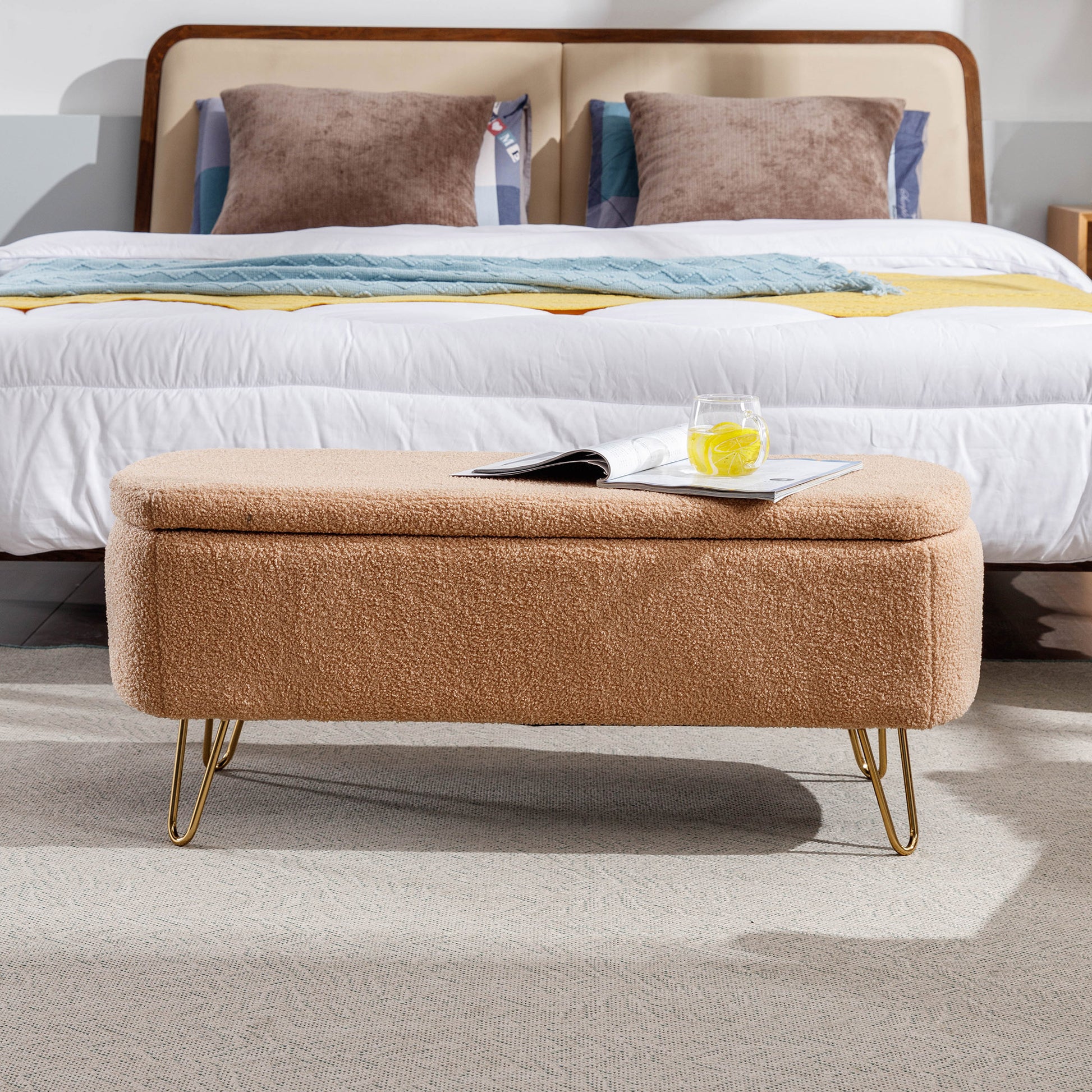 Tan teddy fabric storage ottoman with gold hairpin legs