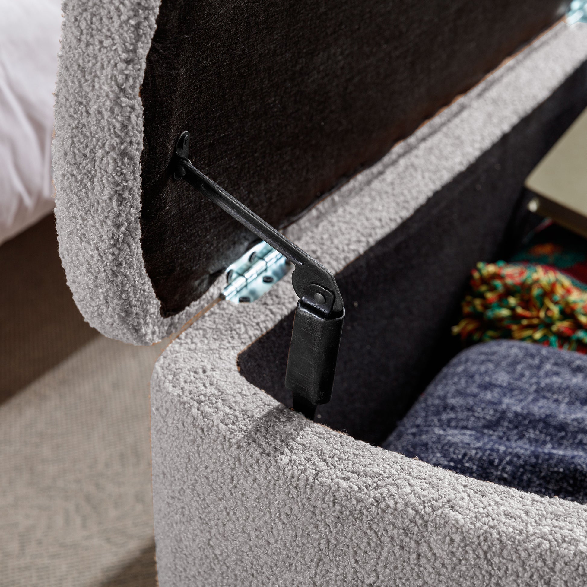 Grey teddy fabric ottoman with lifttop storage for blankets