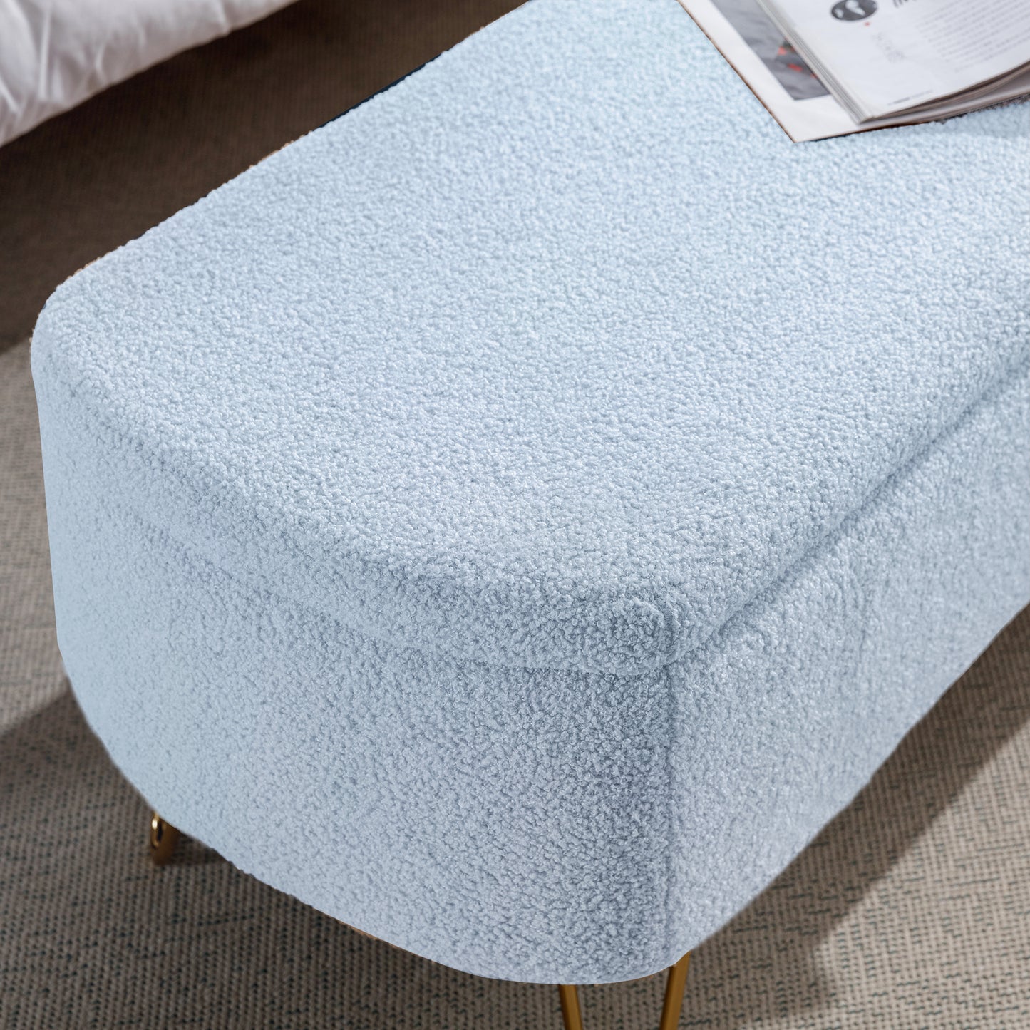 Light blue boucle ottoman with gold legs