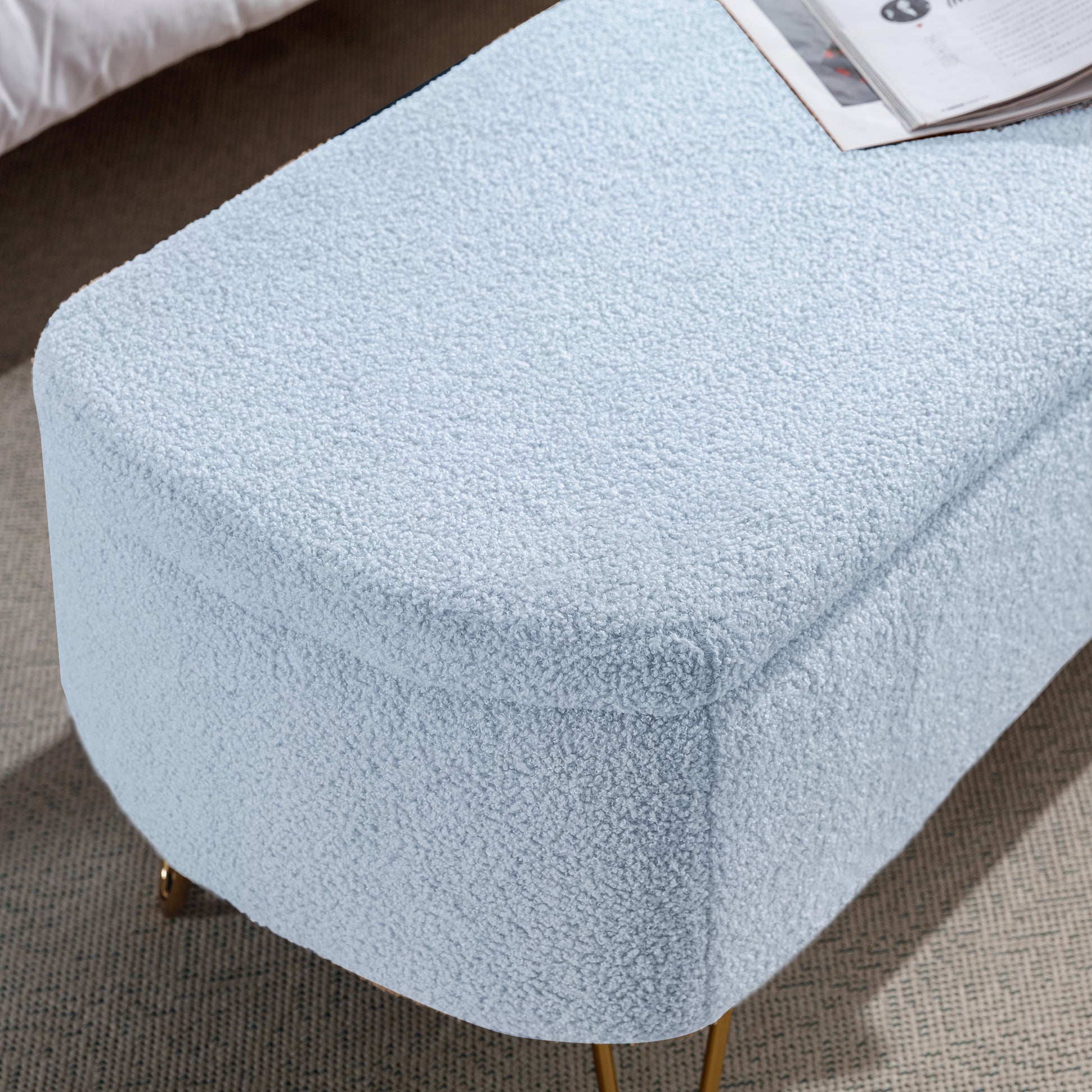 Light blue boucle ottoman with gold legs