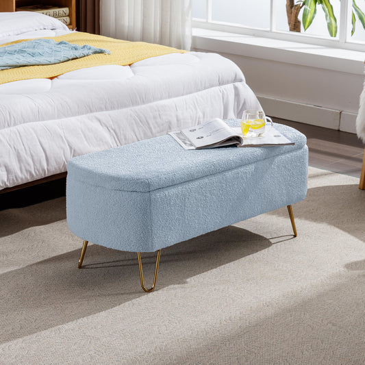 Light blue teddy fabric storage ottoman with gold legs