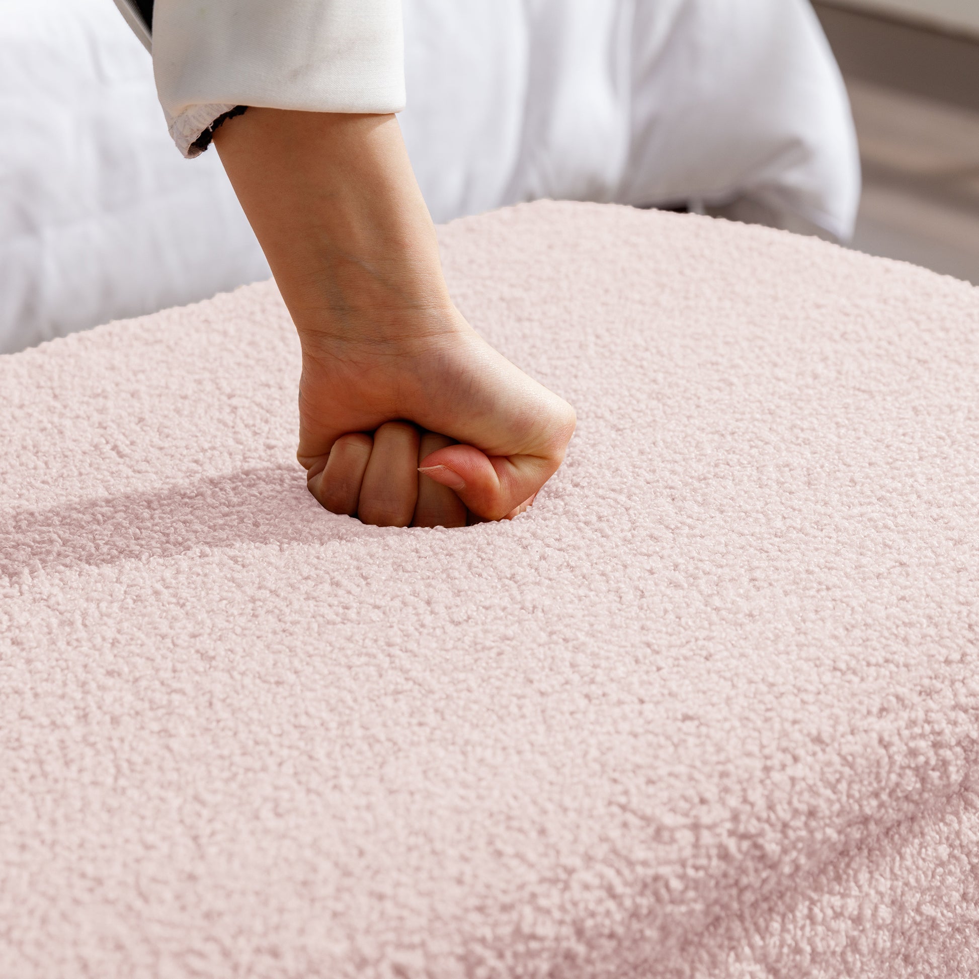 Soft pink sherpa throw blanket with plush texture