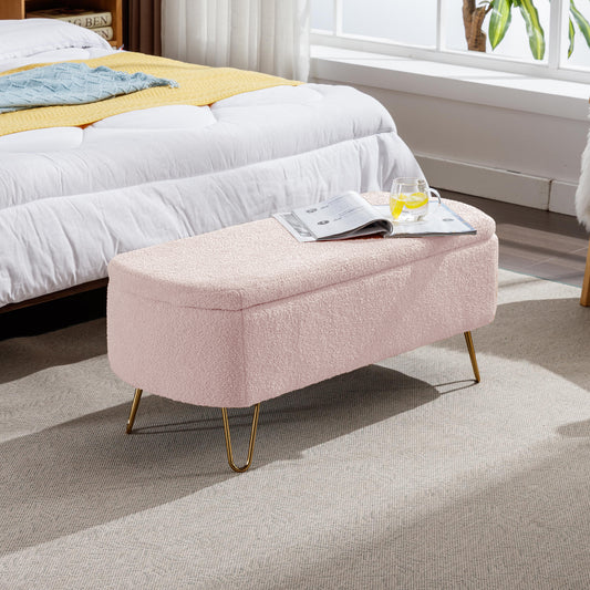 Pink boucle storage ottoman with gold hairpin legs