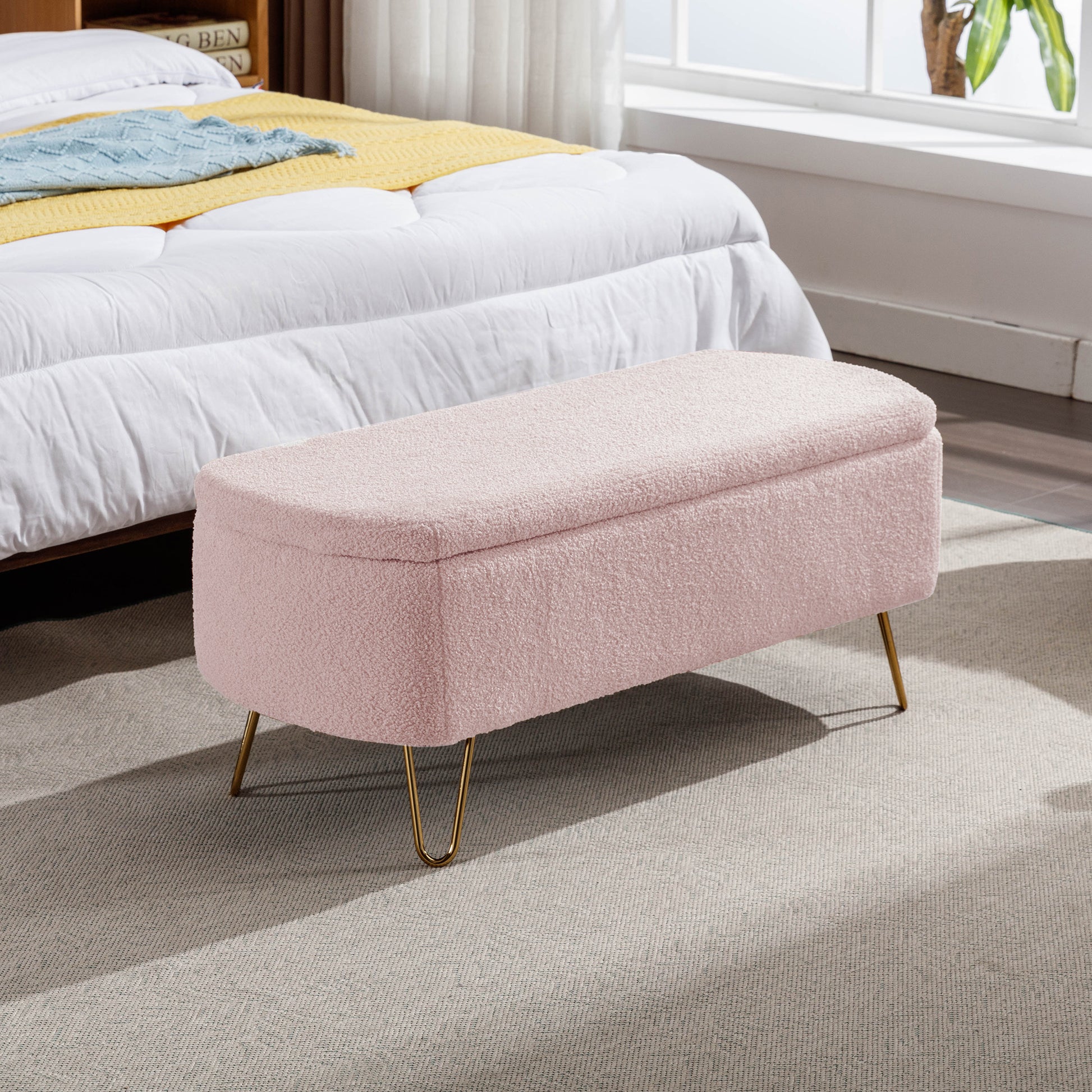 Pink sherpa storage bench with gold hairpin legs