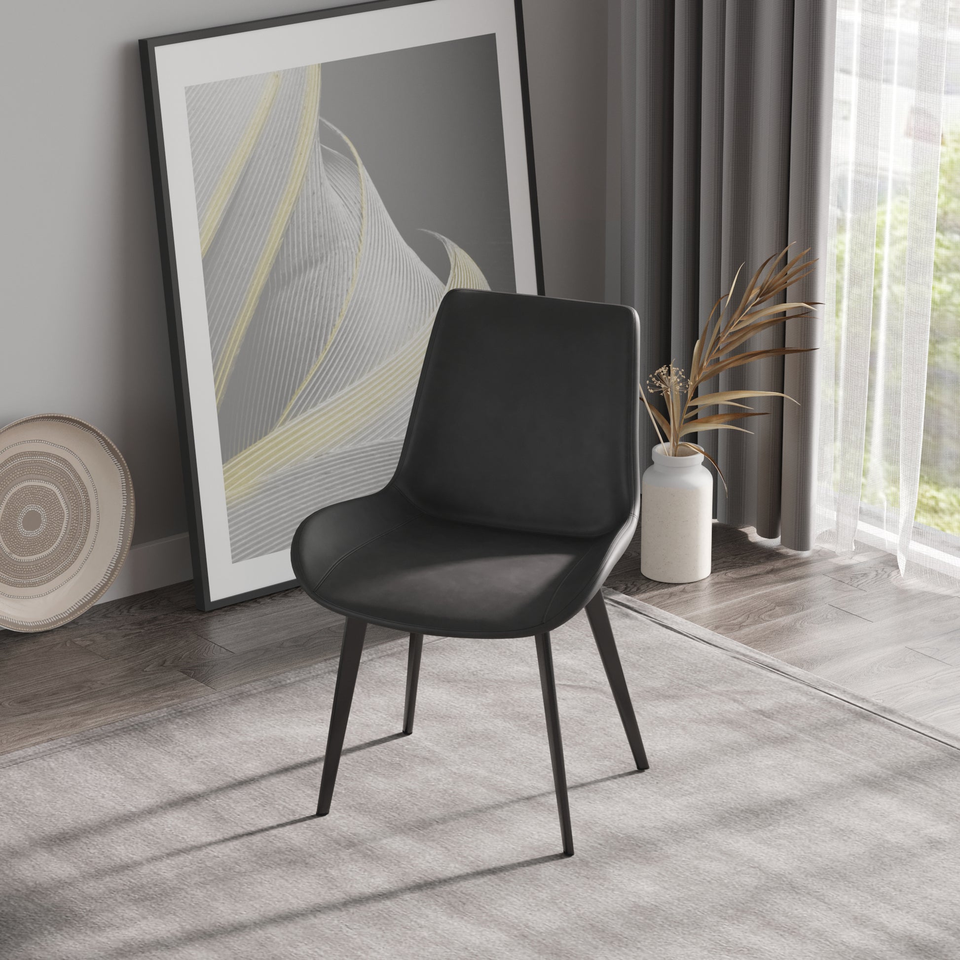 Black faux leather dining chair with black metal legs