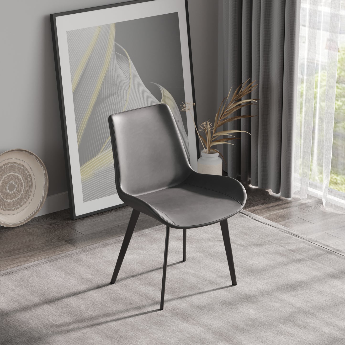 Modern grey faux leather dining chair with sleek black metal legs