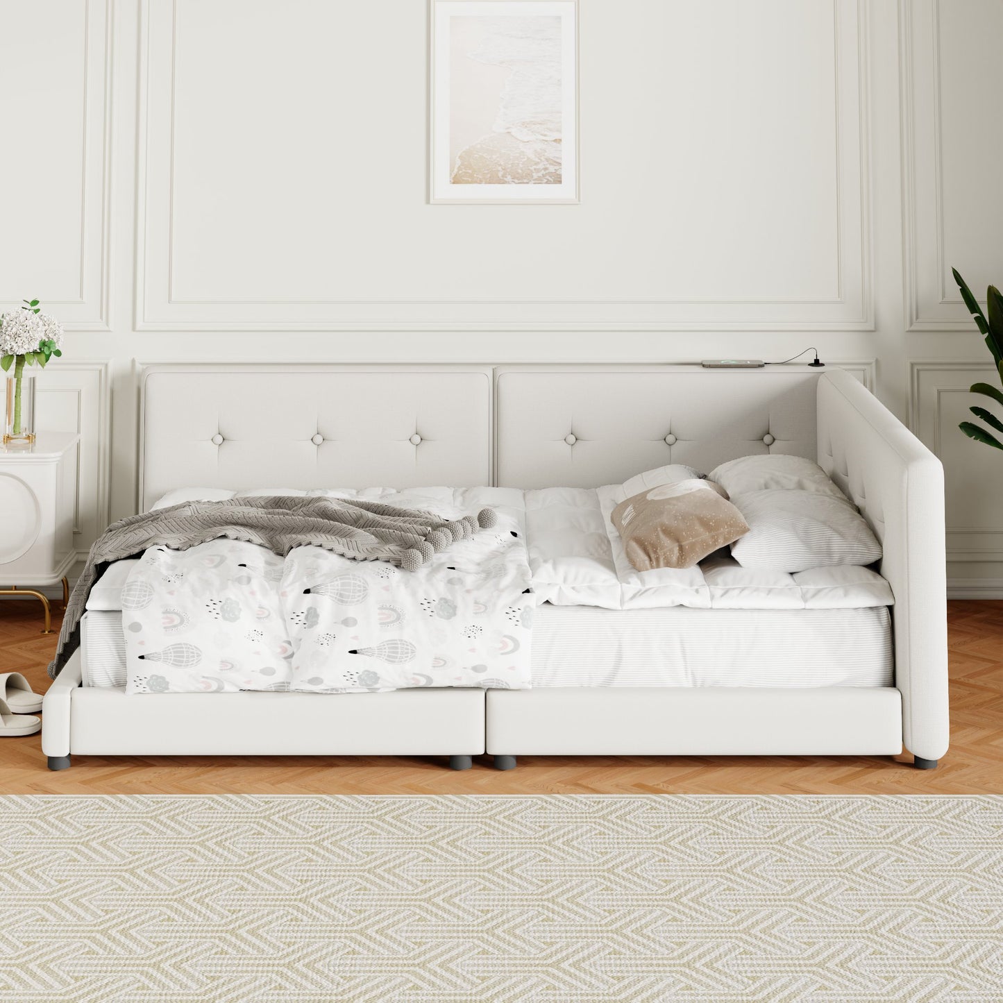 Tufted white upholstered twin daybed with whimsical hot air balloon bedding and gray throw