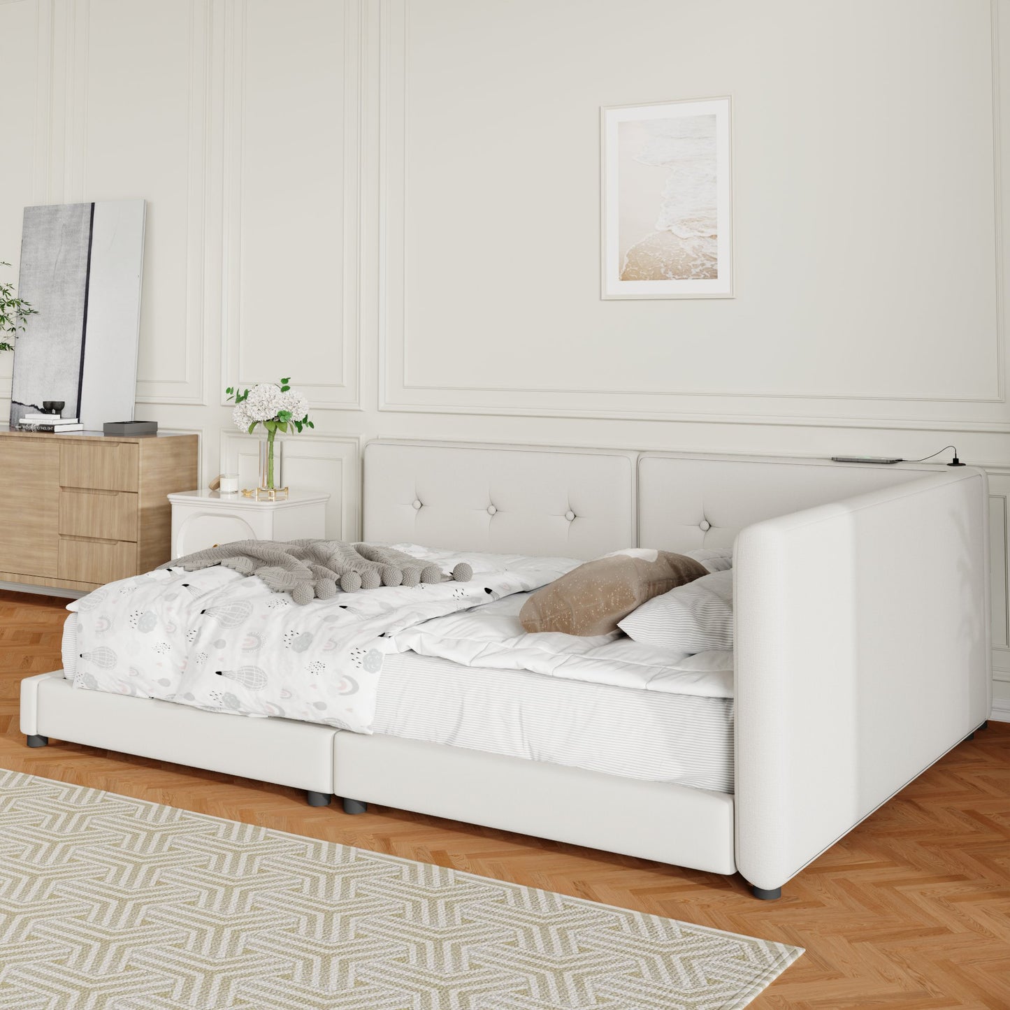 White upholstered daybed with tufted headboard and integrated side table