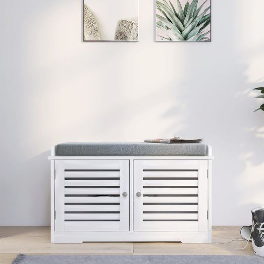 White slatted entryway bench with grey cushioned seat