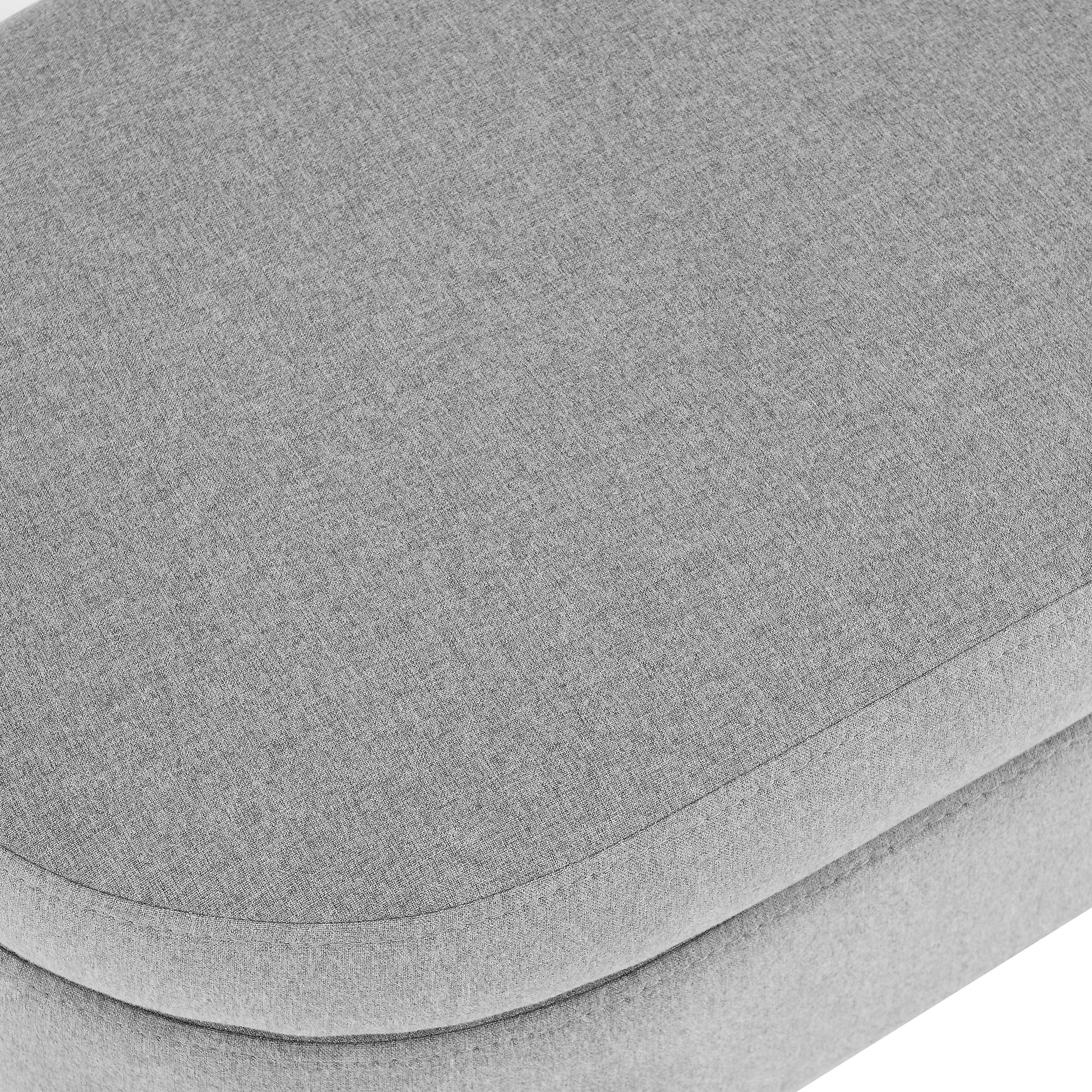 Closeup of grey textured fabric ottoman detail