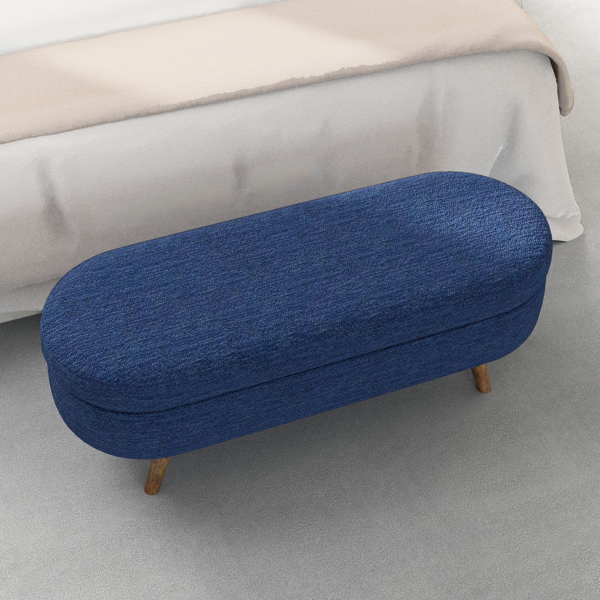 Oval blue denim storage ottoman with wood legs