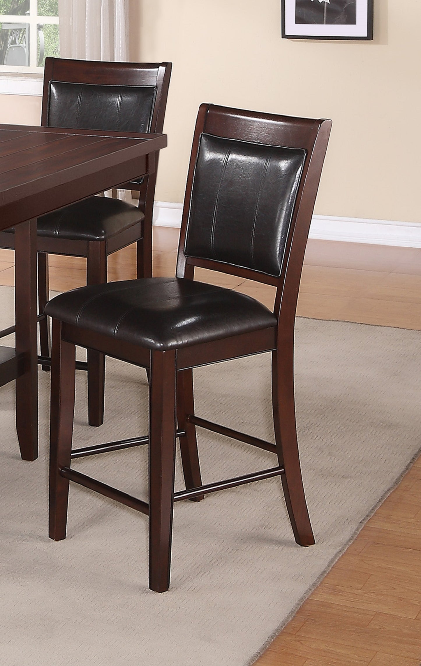Dark brown wooden bar stool with tufted black faux leather seat and backrest