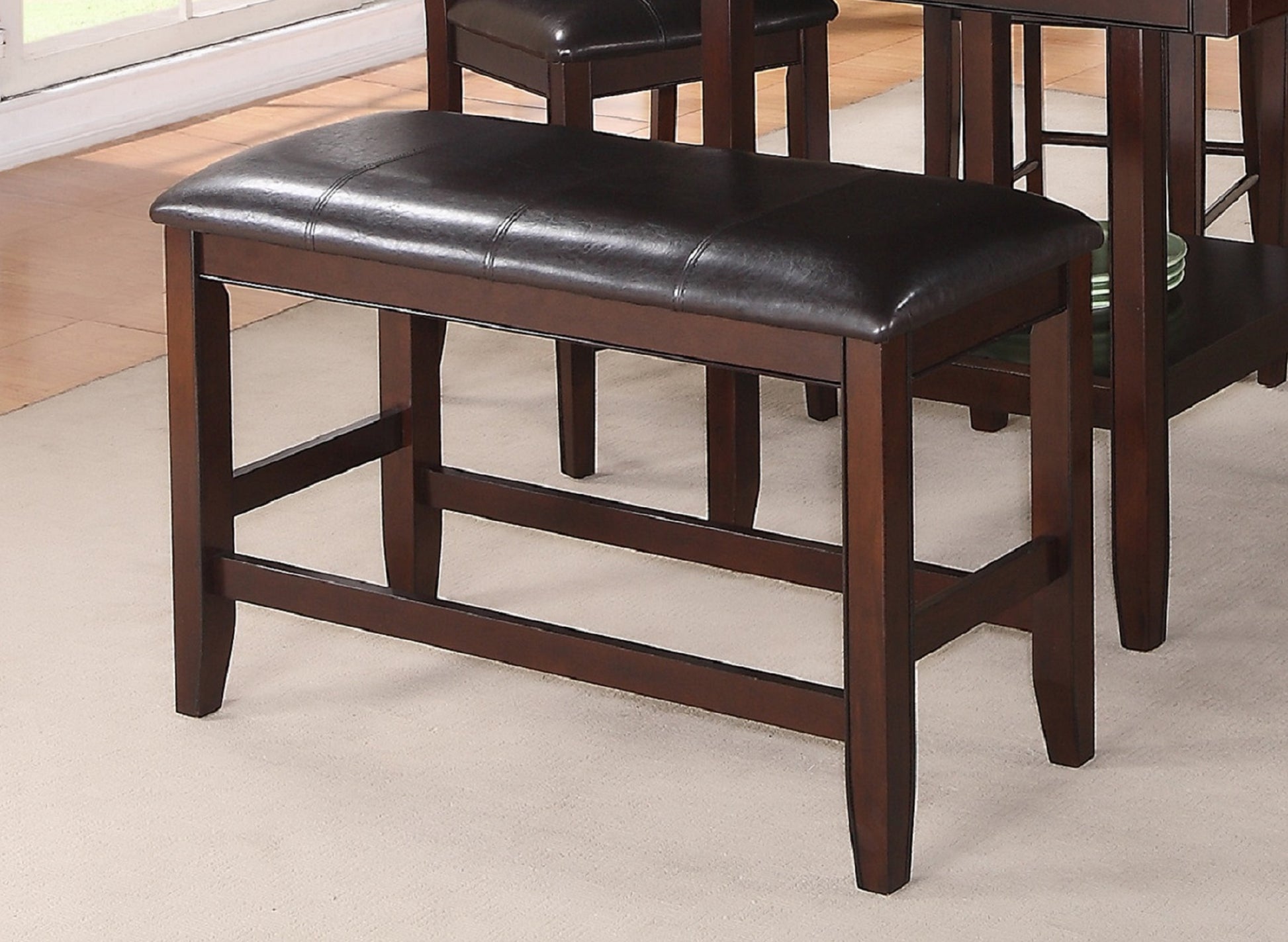 Dark brown faux leather counter stool with dark wood frame and stitching detail