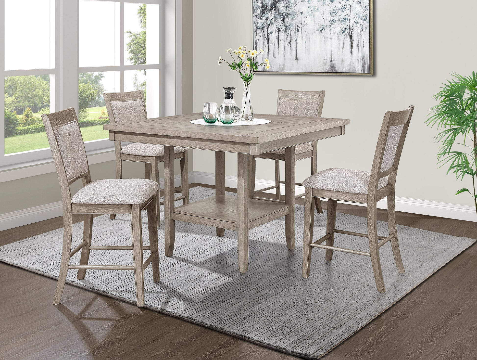 Gray wash wood counter height table with four upholstered chairs