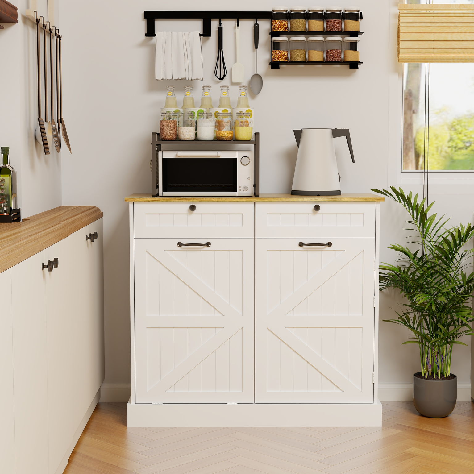 White kitchen cabinet with barnstyle doors and dark handles