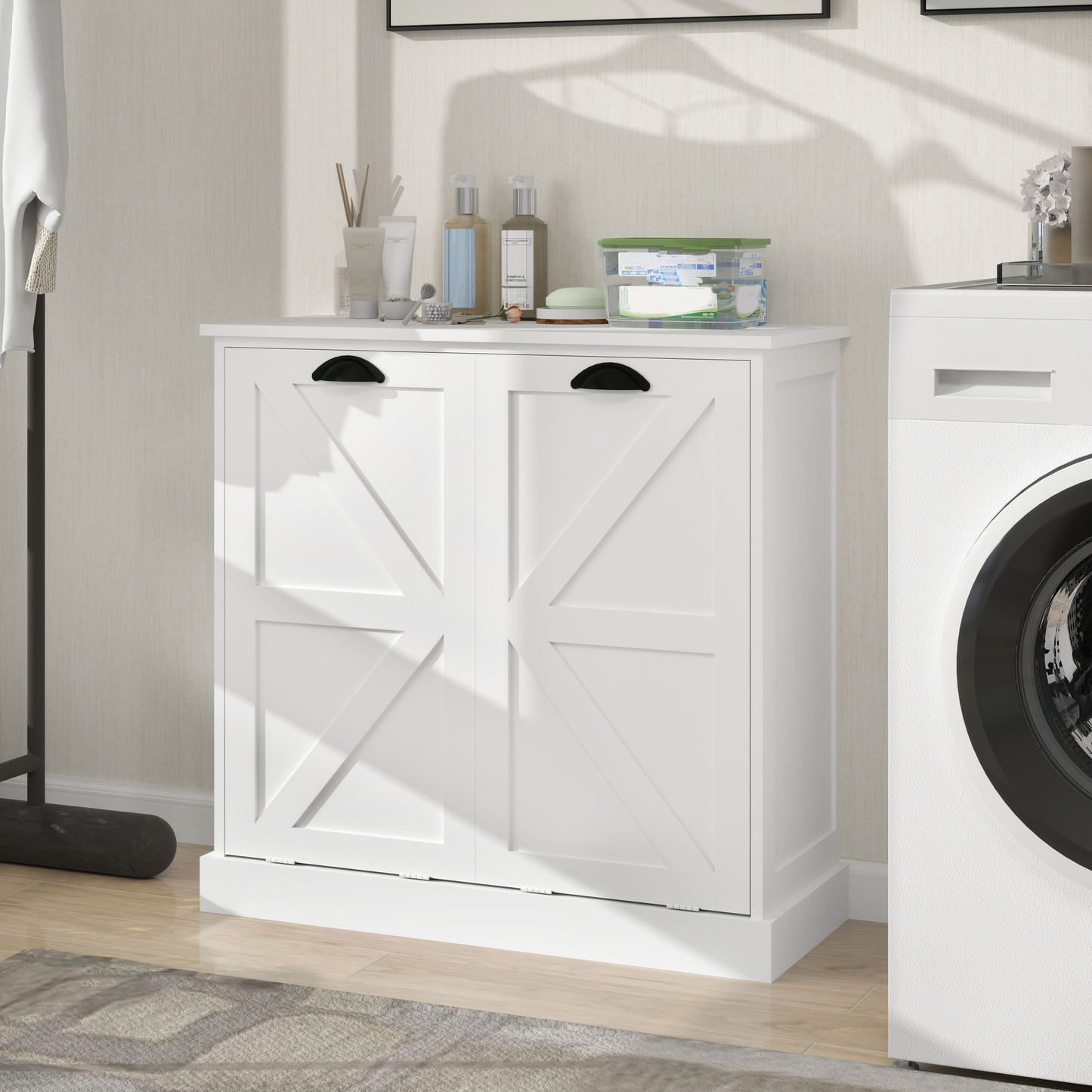 White farmhouse laundry cabinet with double barn doors and black hardware