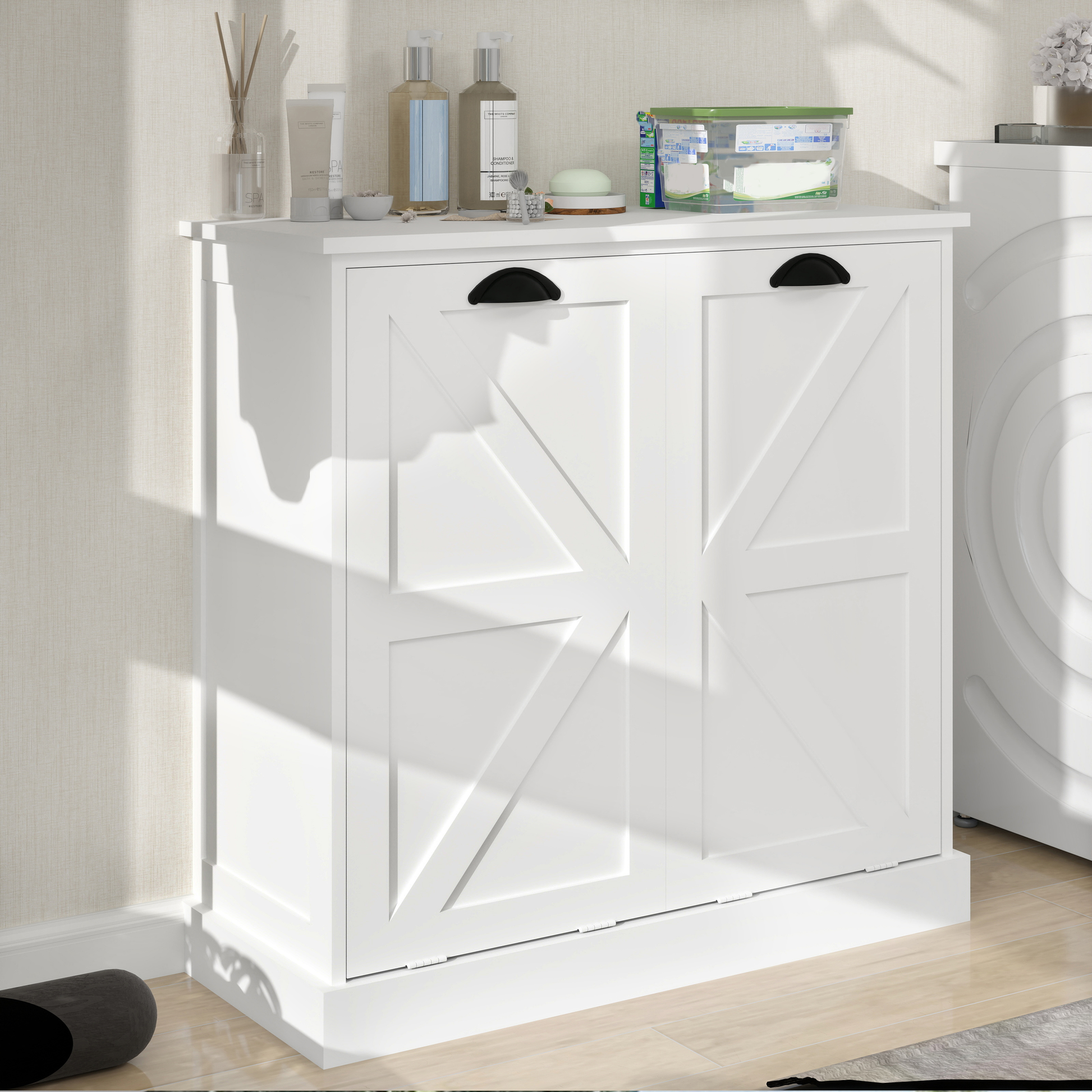 White barn door laundry cabinet with black cup pull handles