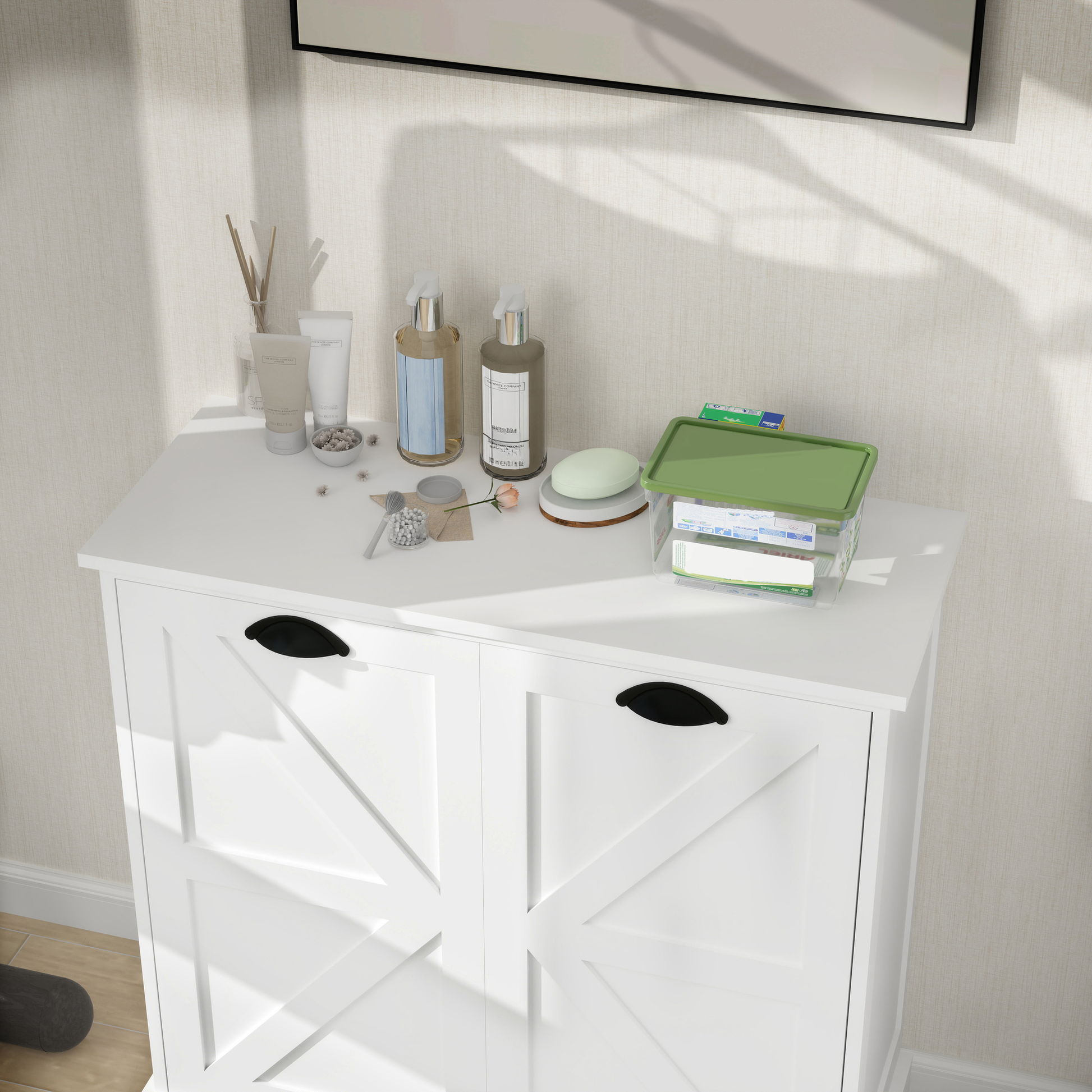 White wooden cabinet with black handles