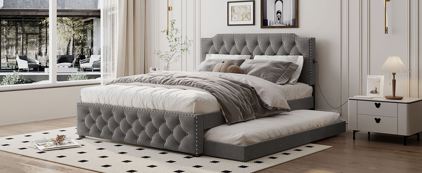 Tufted gray upholstered bed frame with pullout trundle and crystal accents