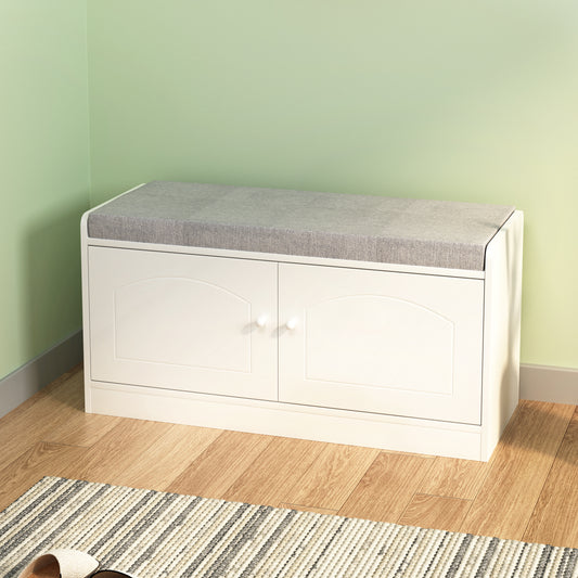 White storage bench with grey cushioned top and two arched doors