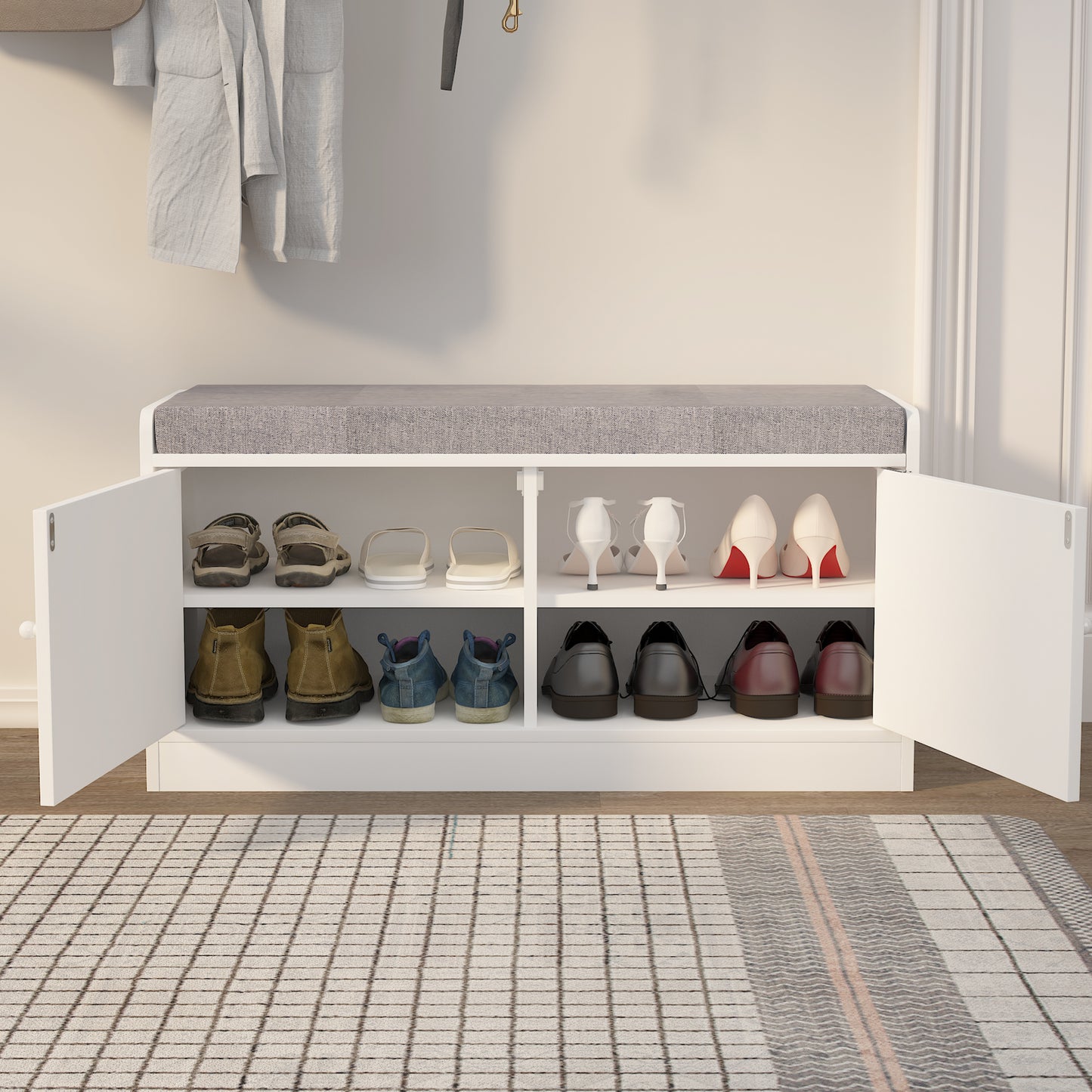 White shoe cabinet with gray cushioned top and multiple shoe compartments