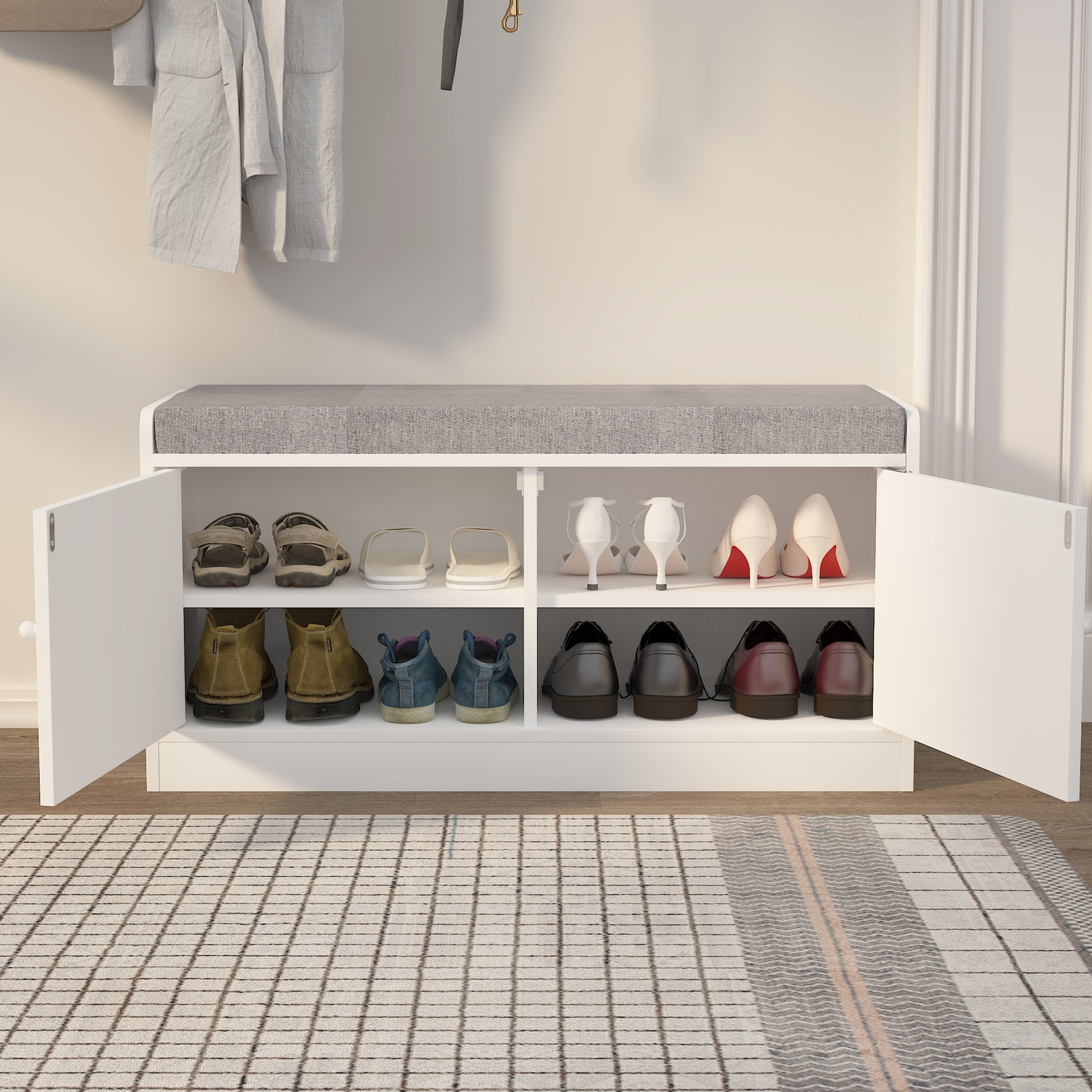 White shoe cabinet with gray cushioned top and multiple shoe compartments