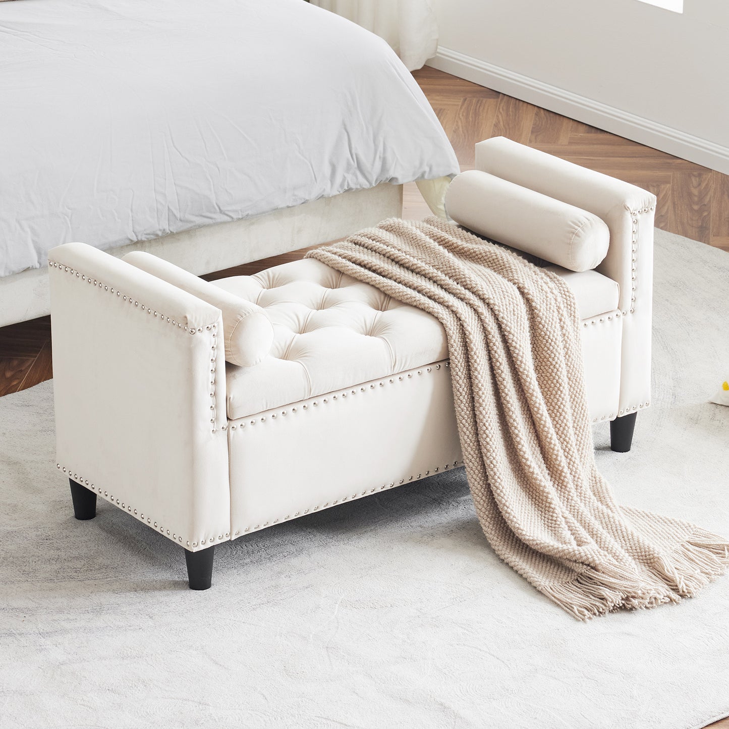 Cream velvet tufted storage bench with silver nailhead trim