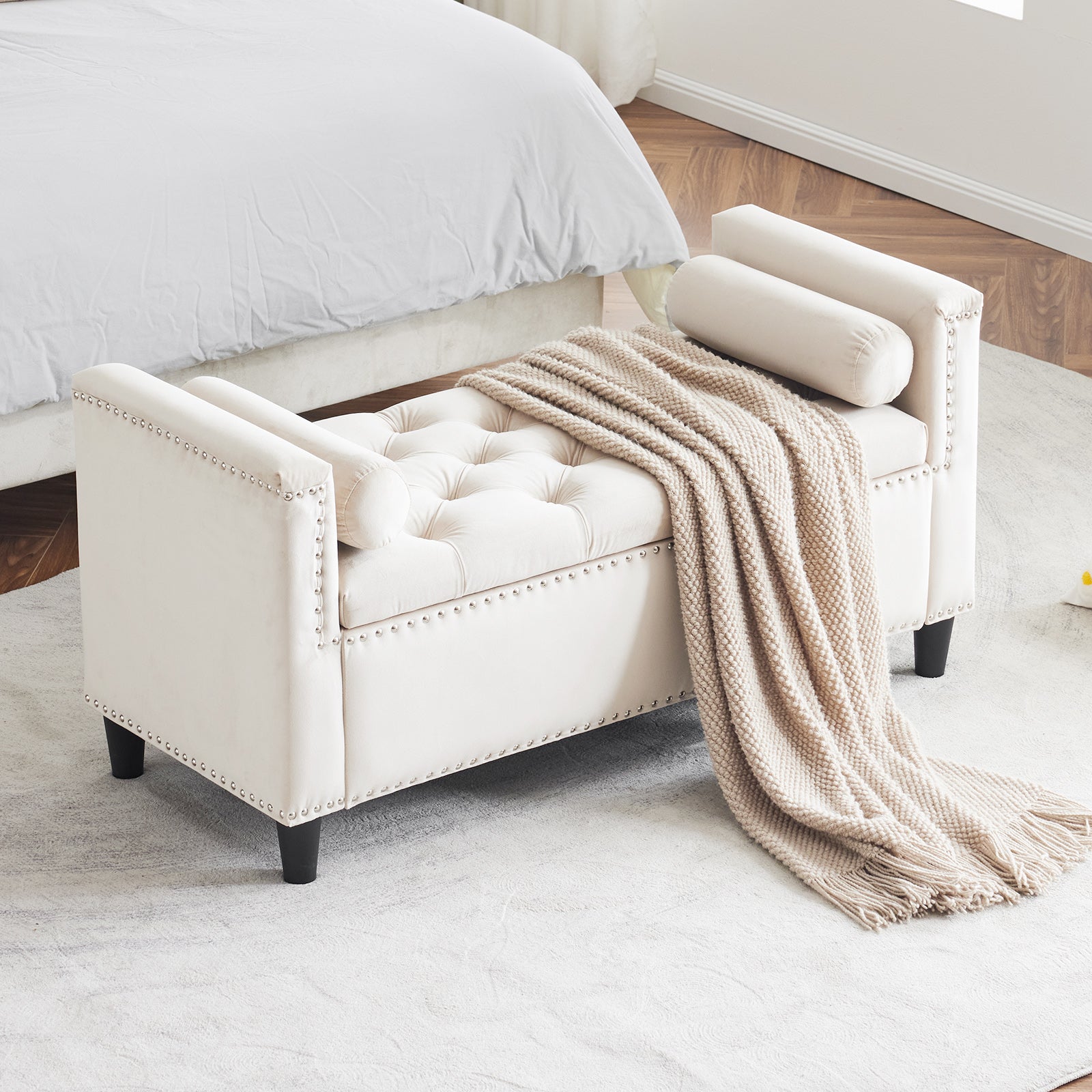 Cream velvet tufted storage bench with silver nailhead trim