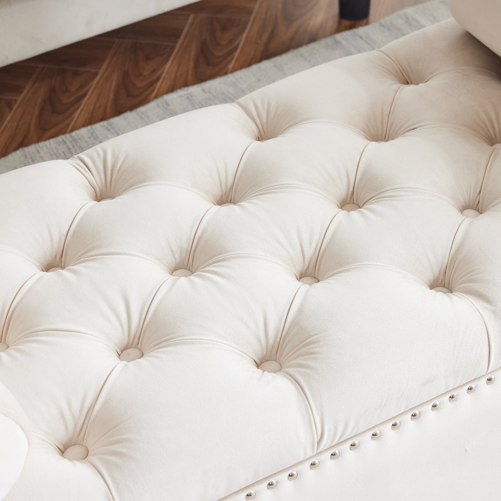 Cream tufted bench ottoman with nailhead trim