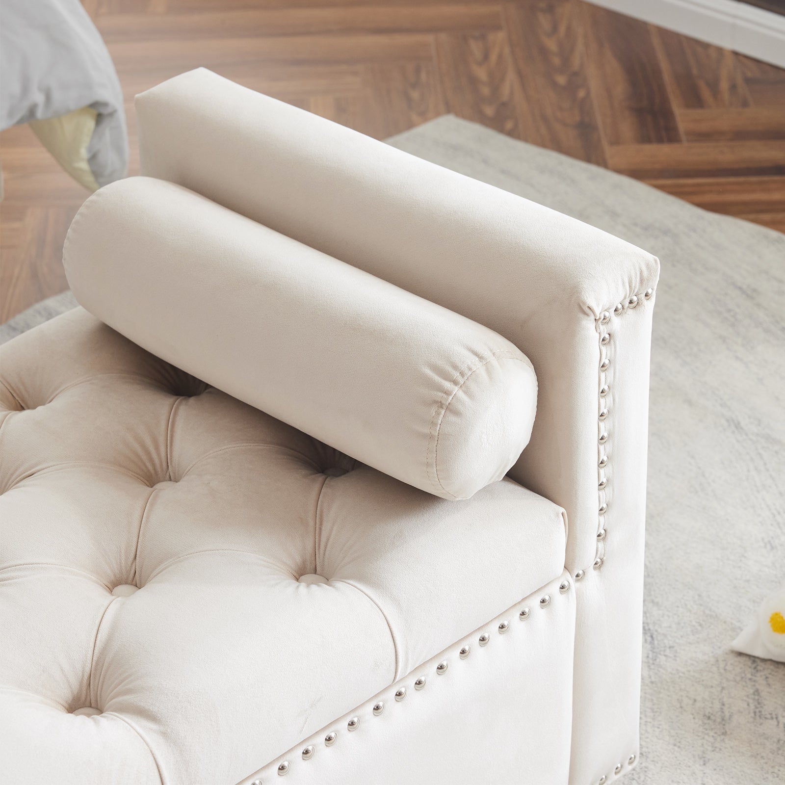 Cream velvet armchair with button tufting and silver nailhead trim