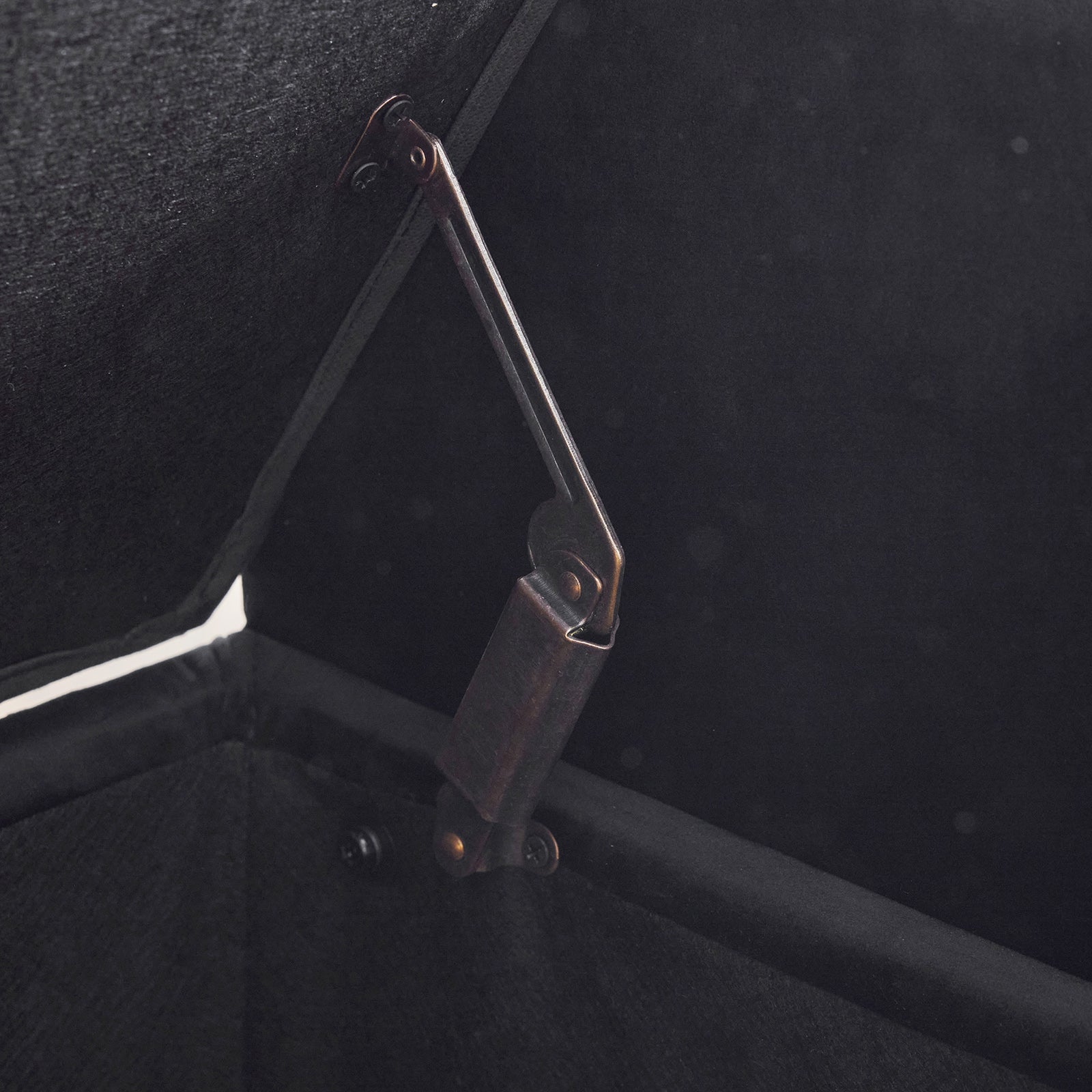 Black ottoman hinge mechanism detail