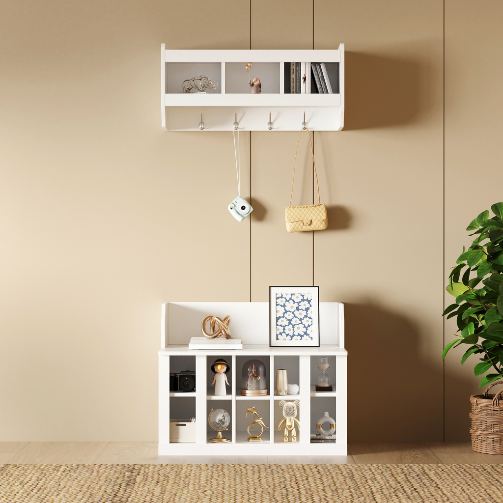 White wallmounted entryway shelf with coat hooks and decorative items
