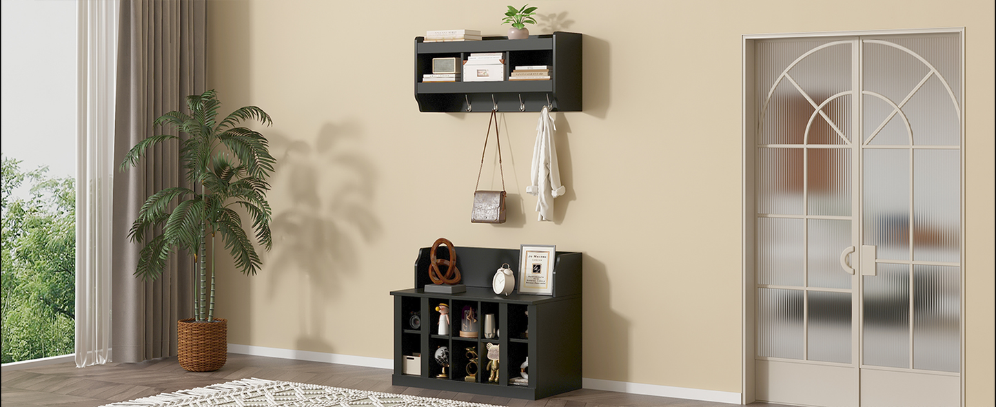 Black entryway organizer shelf with coat hooks and decorative items