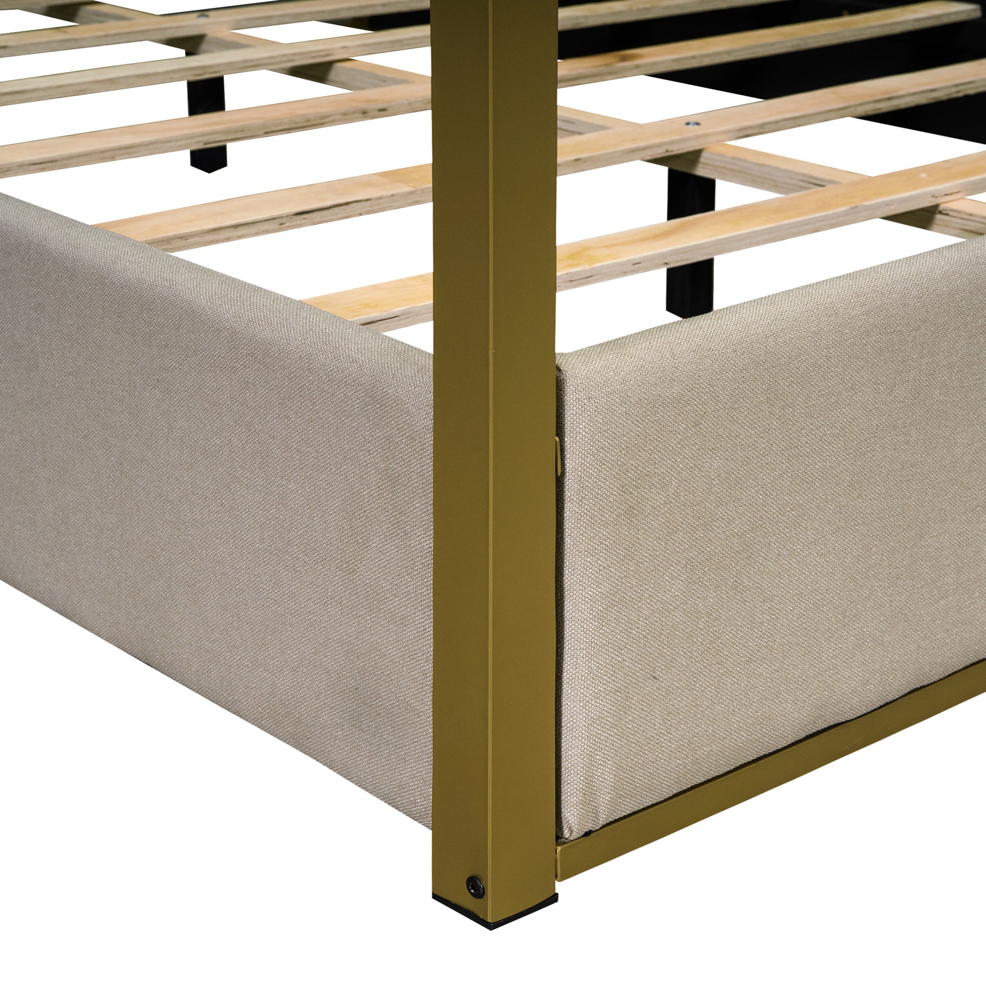 Beige upholstered bed frame with gold metal accents and wooden slats
