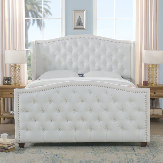 White faux leather tufted wingback bed with silver nailhead trim