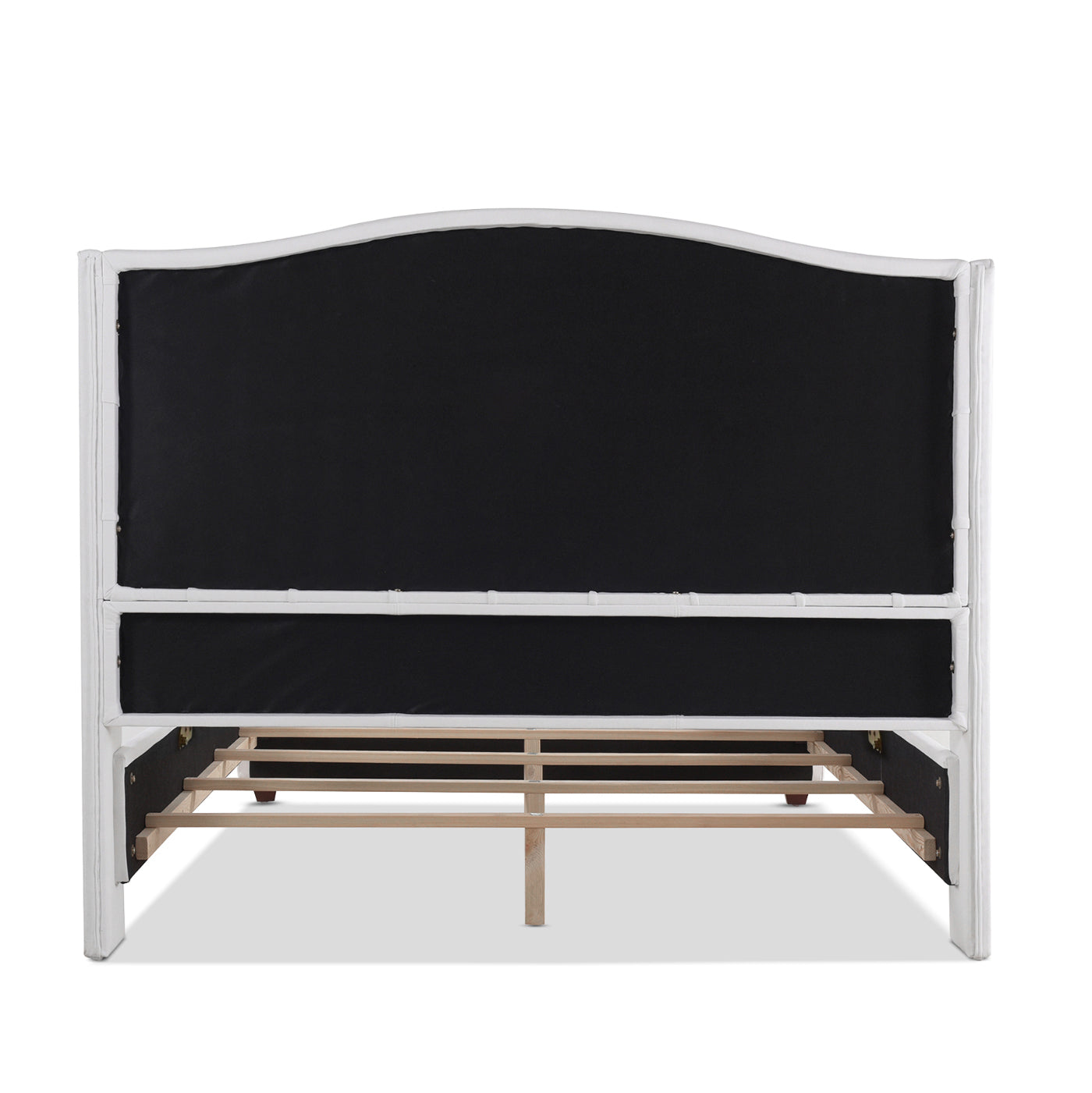 White upholstered headboard with curved top and wooden slats visible