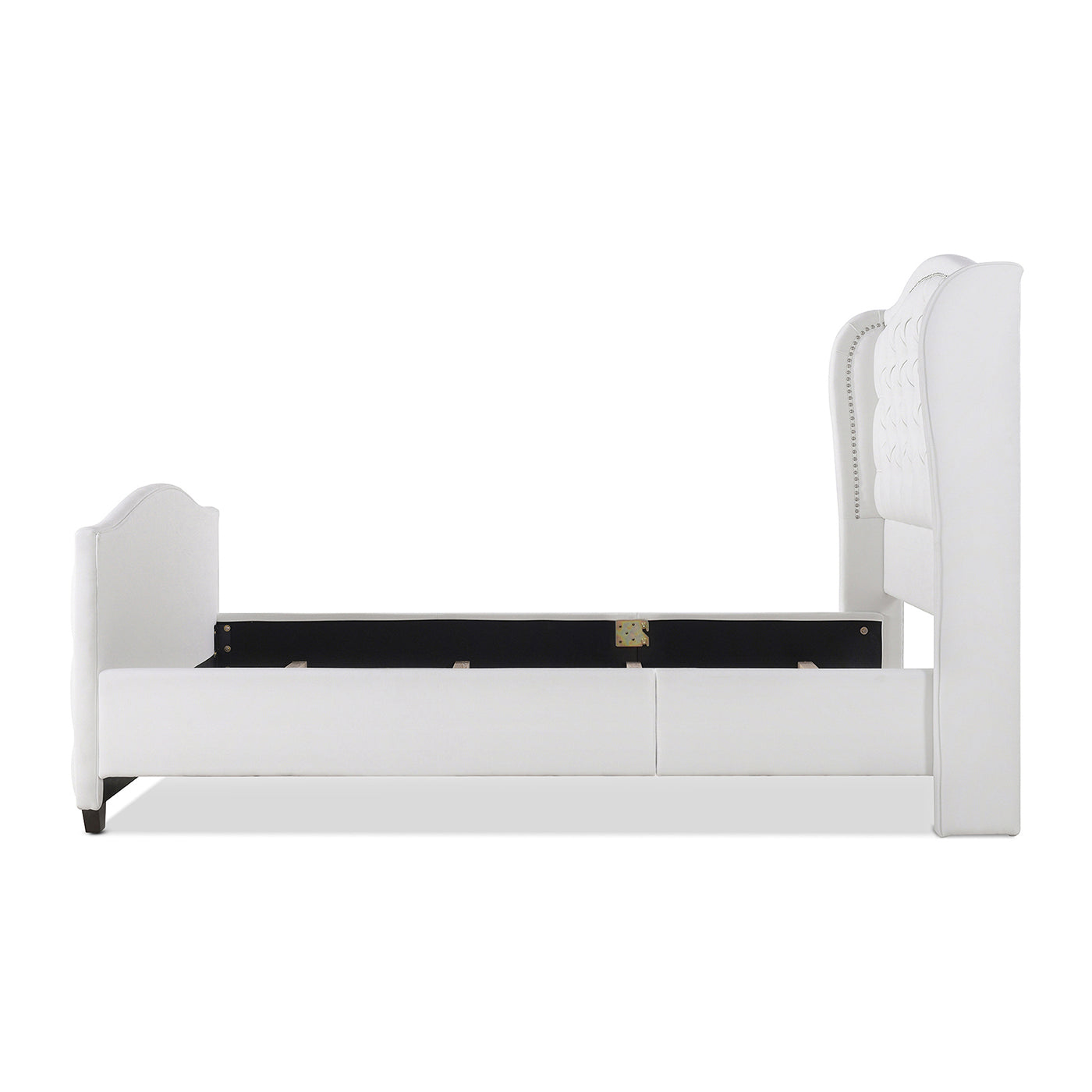 White upholstered wingback bed frame with button tufting and nailhead trim