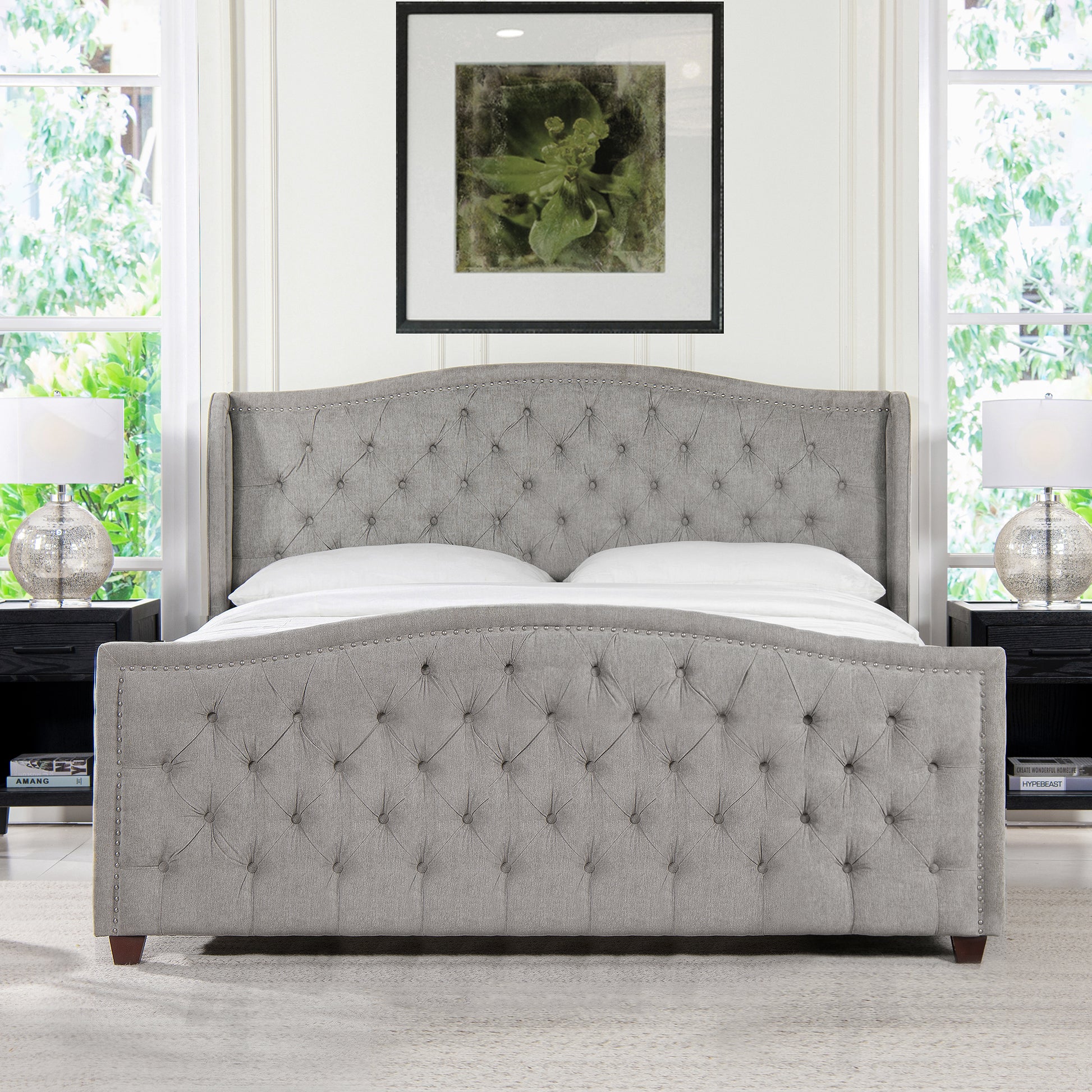 Grey tufted wingback bed with nailhead trim