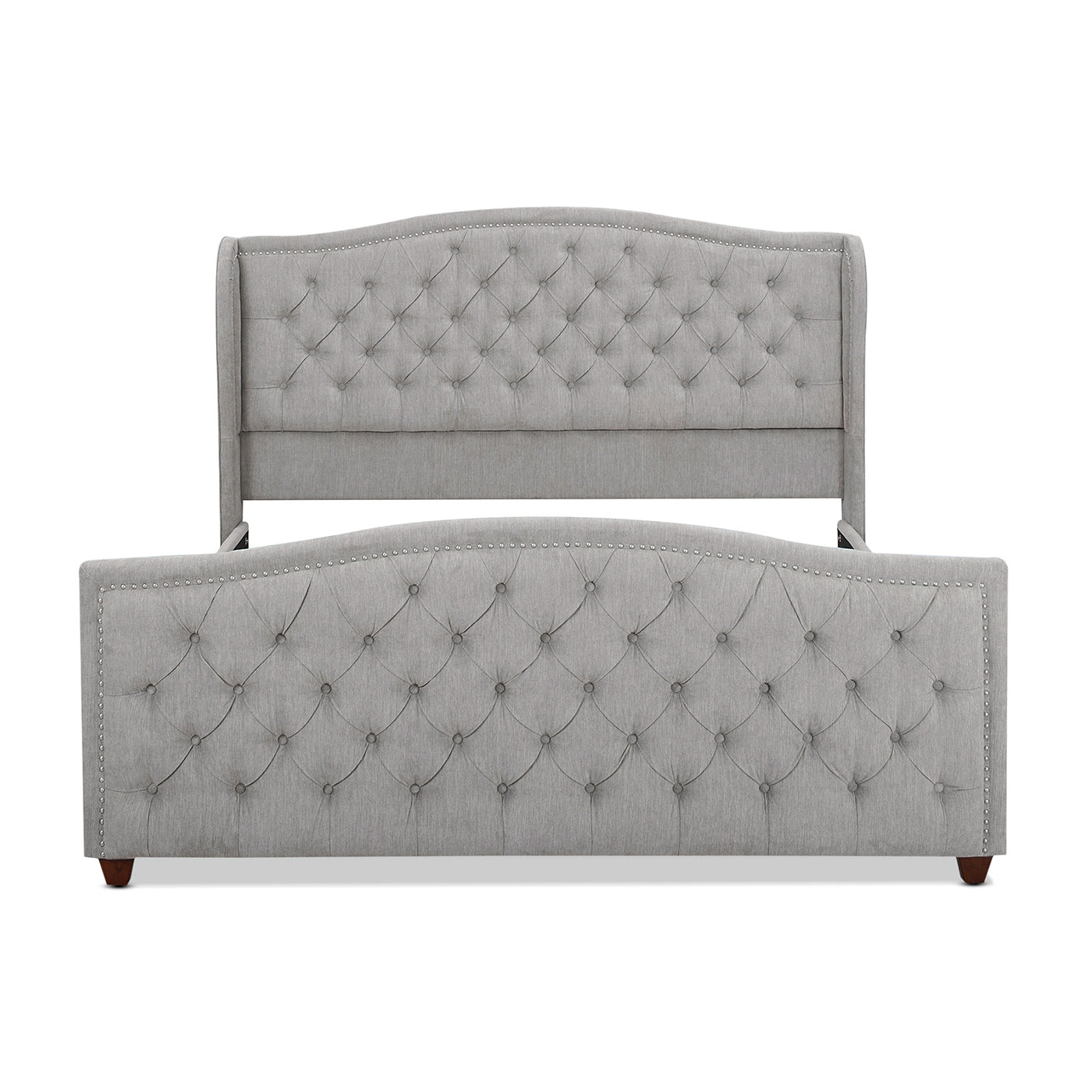 Grey fabric tufted bed frame with silver nailhead trim and arched headboard