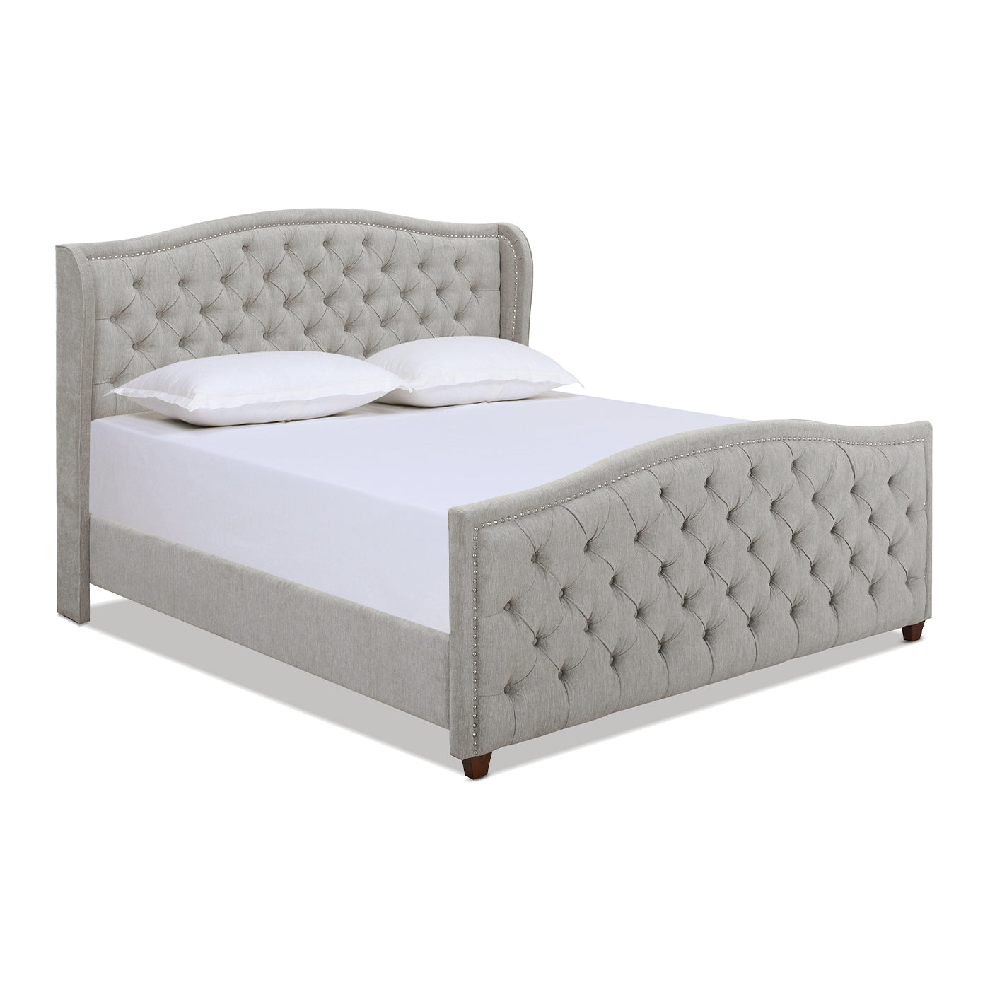 Gray fabric tufted bed with wingback headboard and silver nailhead trim