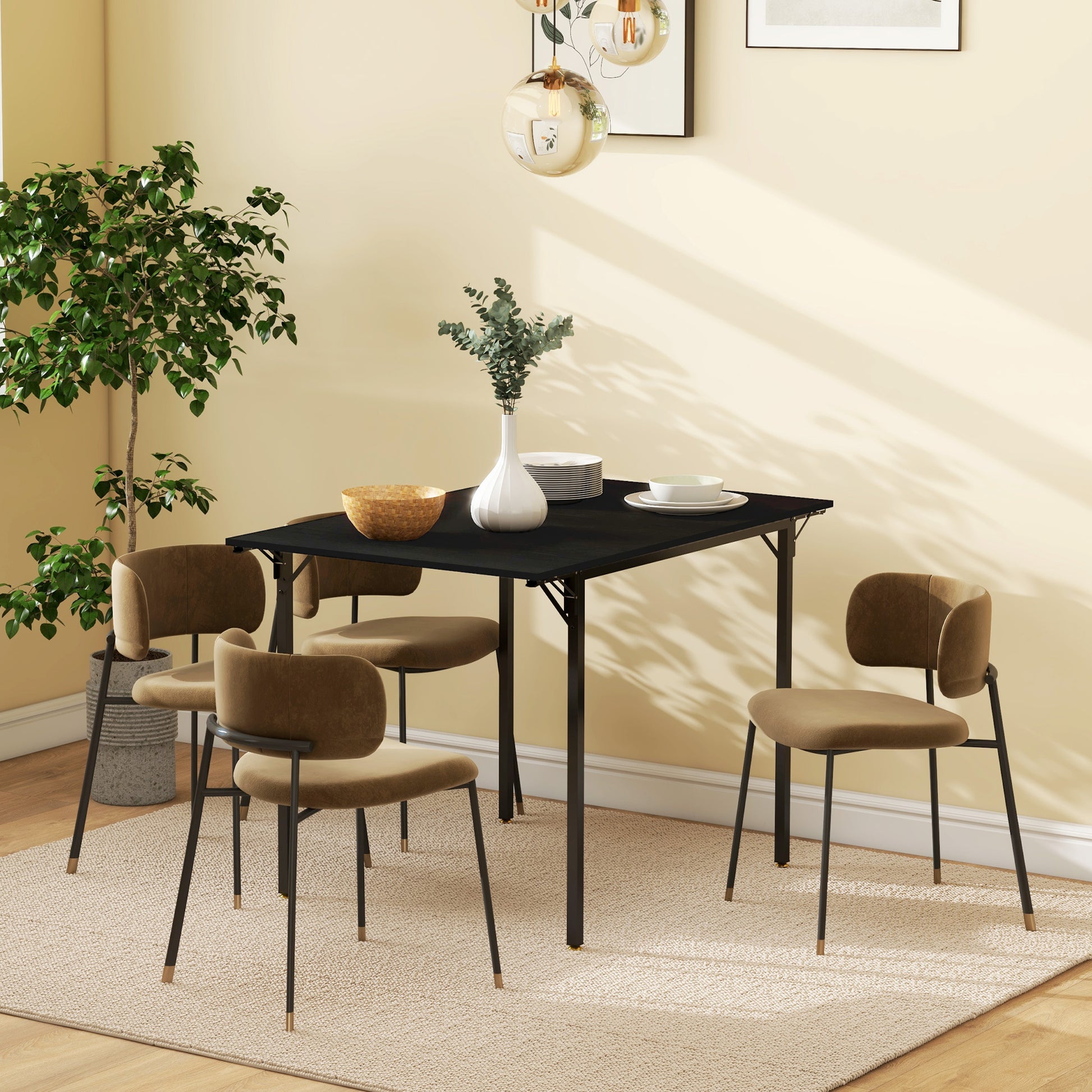 Black modern dining table set with four upholstered chairs and a potted plant