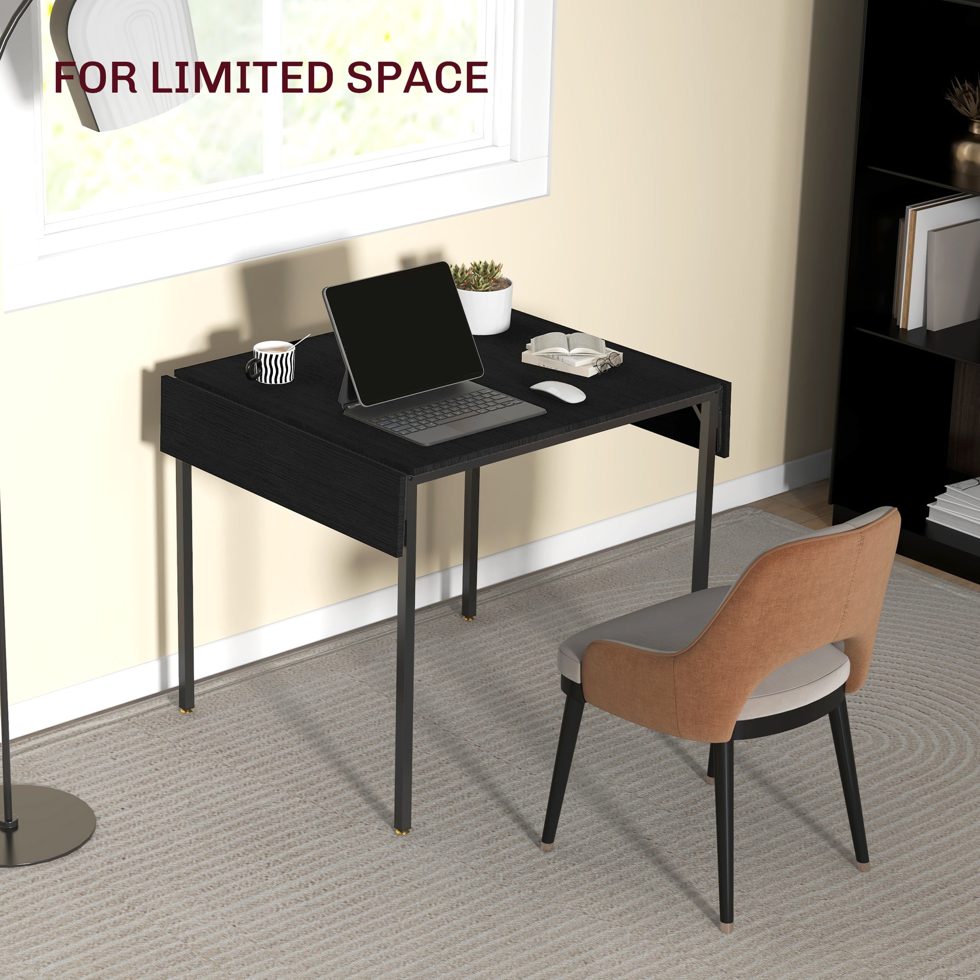 Compact black wood desk with a laptop and mouse for a small home office